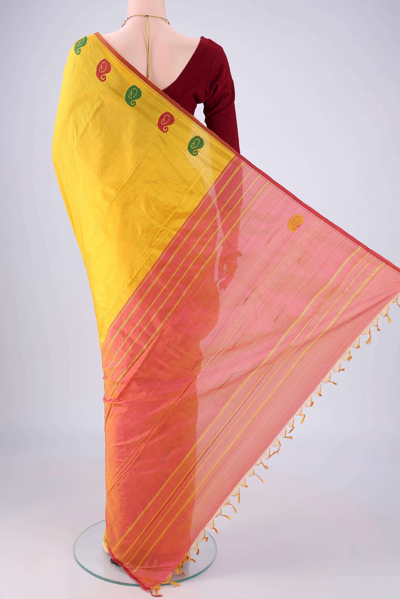 Flat view of Yellow Kanchipuram Silk Saree with Plain Body and Thread Border. 