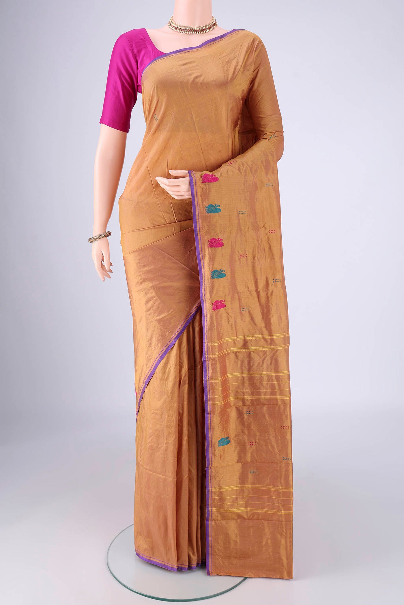 Brown Kanchipuram Silk Saree with Jacquard With Thread Butta on the body and Thread Border.  displayed on a mannequin