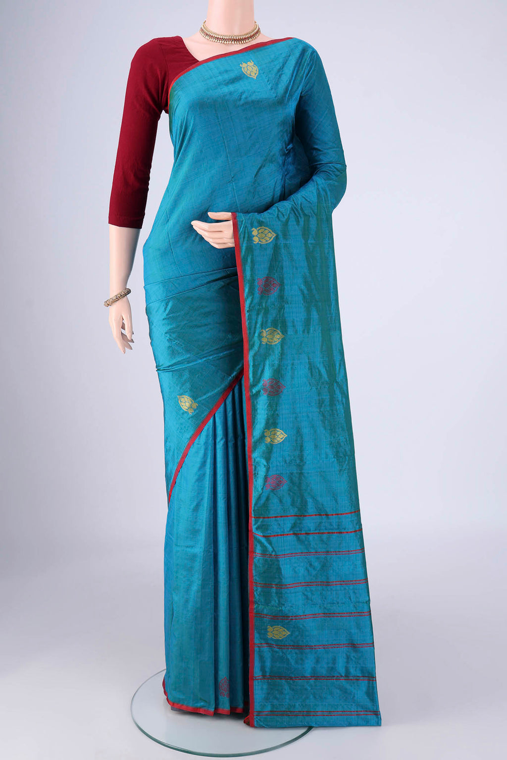 Blue Kanchipuram Silk Saree with Plain Body and Thread Border.  displayed on a mannequin