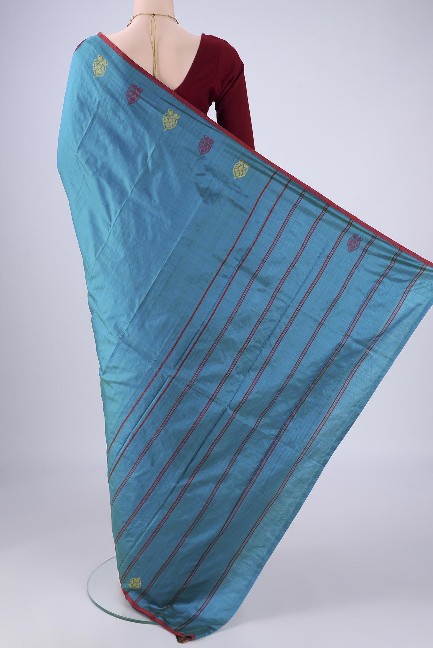 Flat view of Blue Kanchipuram Silk Saree with Plain Body and Thread Border. 