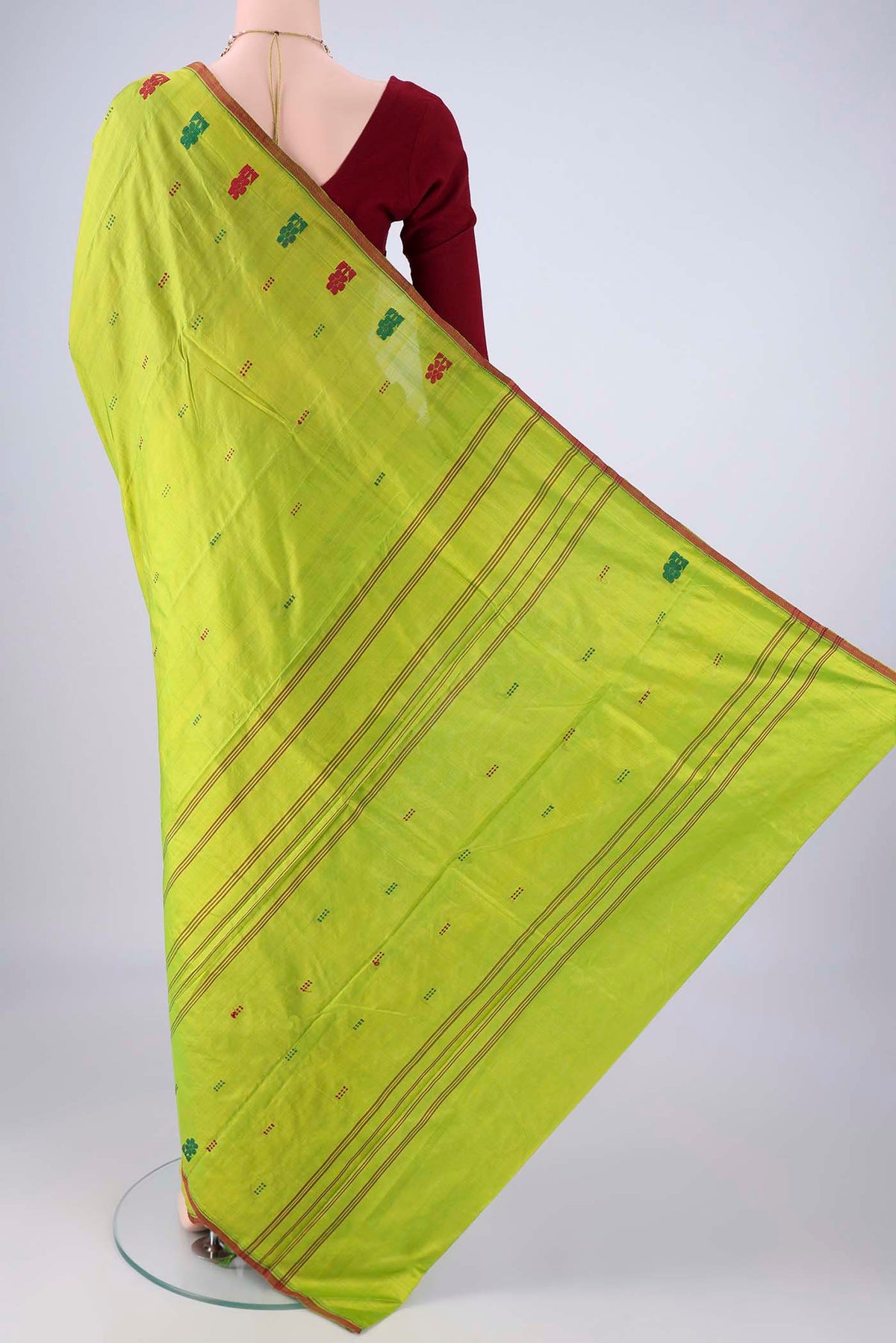 Flat view of Parrot Green Kanchipuram Silk Saree with Thread Butta on the body and Thread Border. 