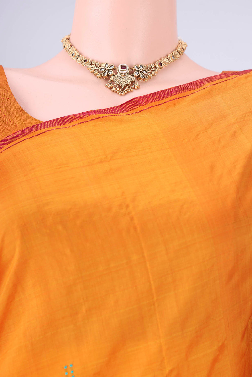 Border image of Orange Kanchipuram Silk Saree with Plain Body and Thread Border. 