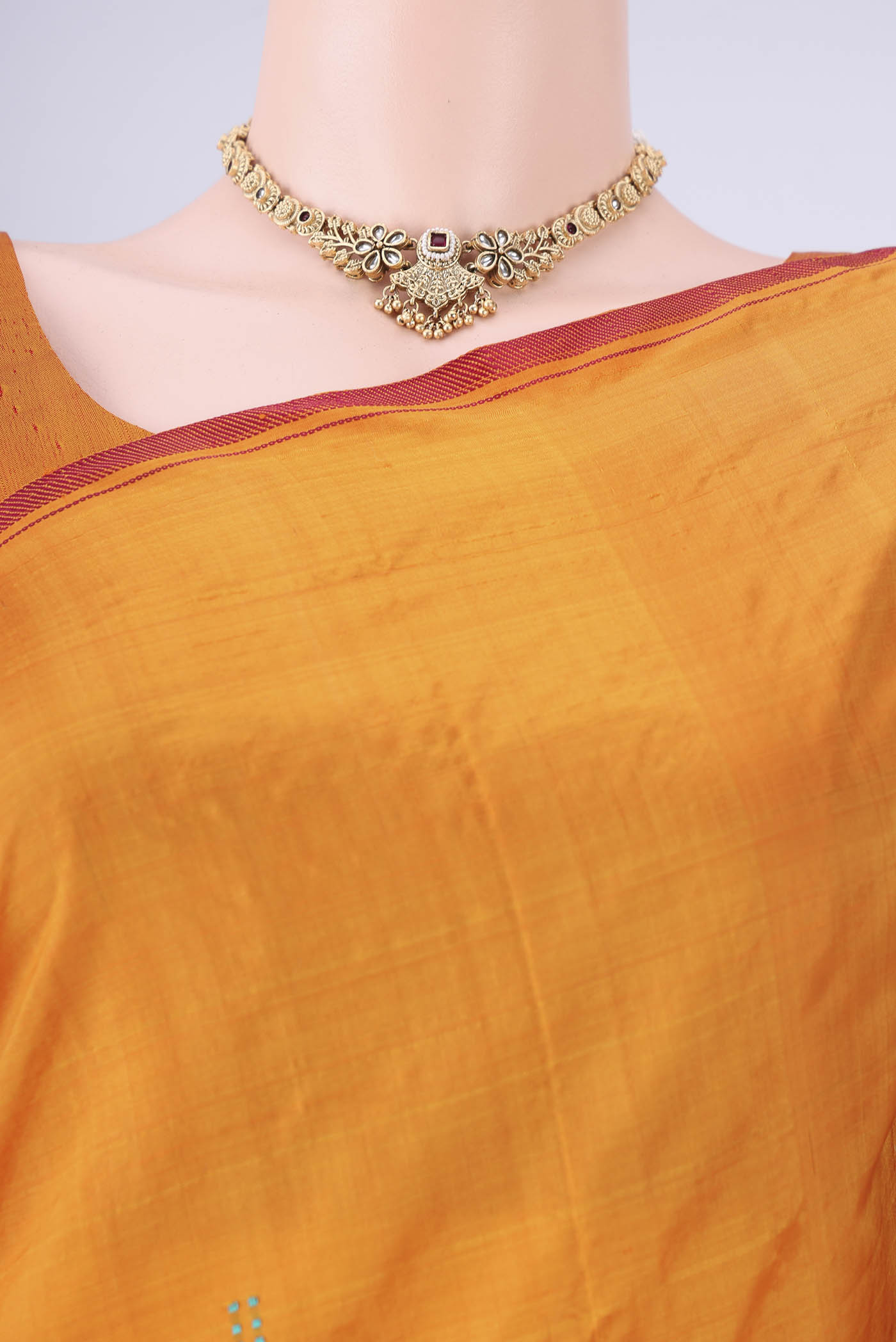 Border image of Orange Kanchipuram Silk Saree with Plain Body and Thread Border. 