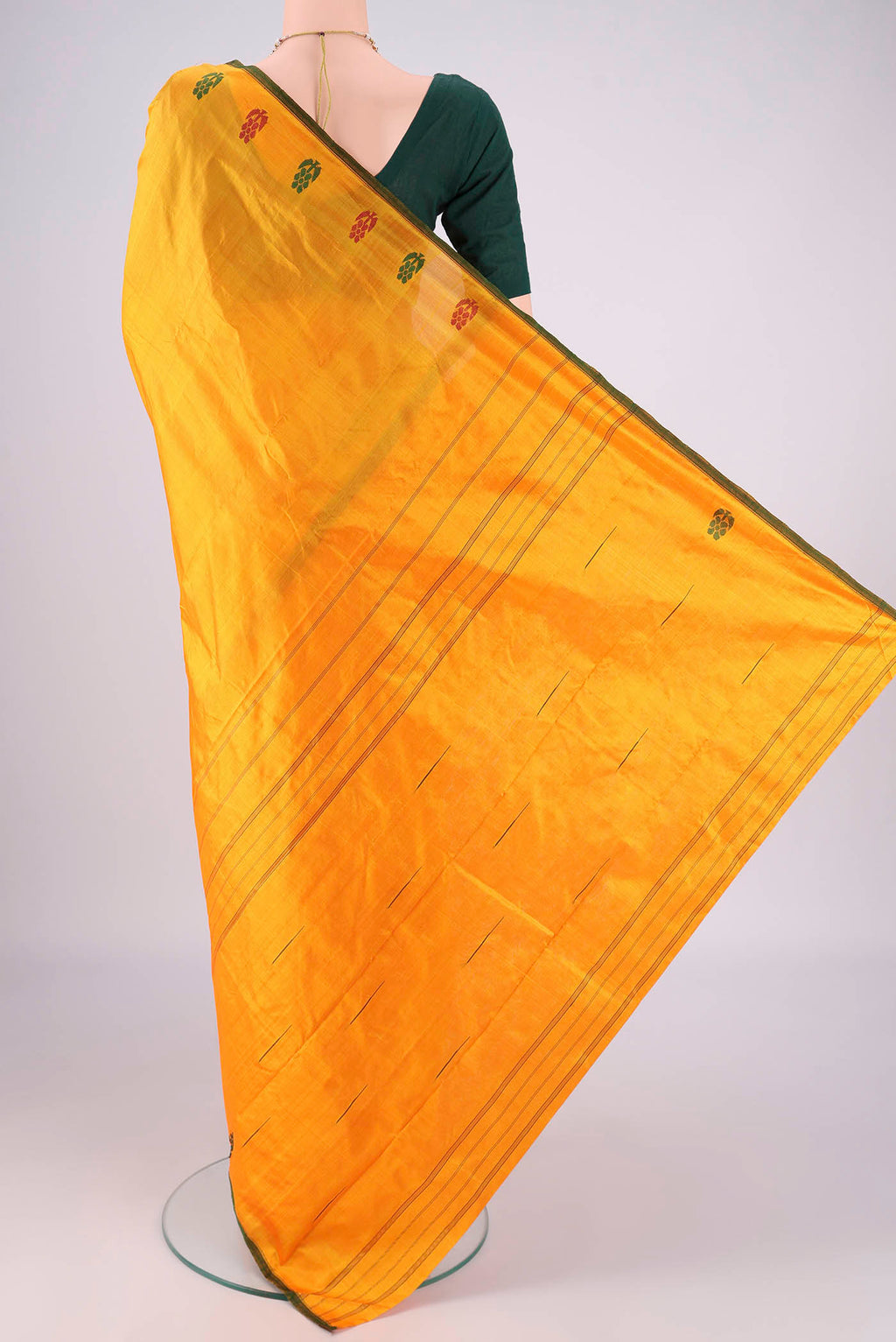 Flat view of Orange Kanchipuram Silk Saree with Plain Body and Thread Border. 