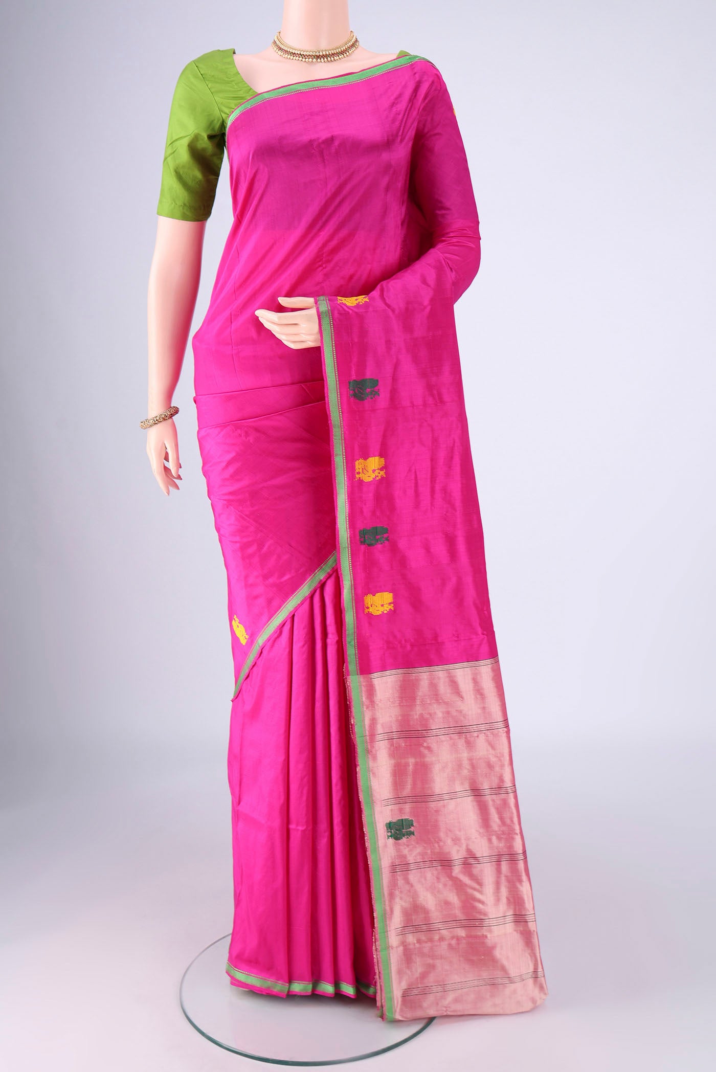 Rani Pink Kanchipuram Silk Saree with Plain Body and Thread Border.  displayed on a mannequin