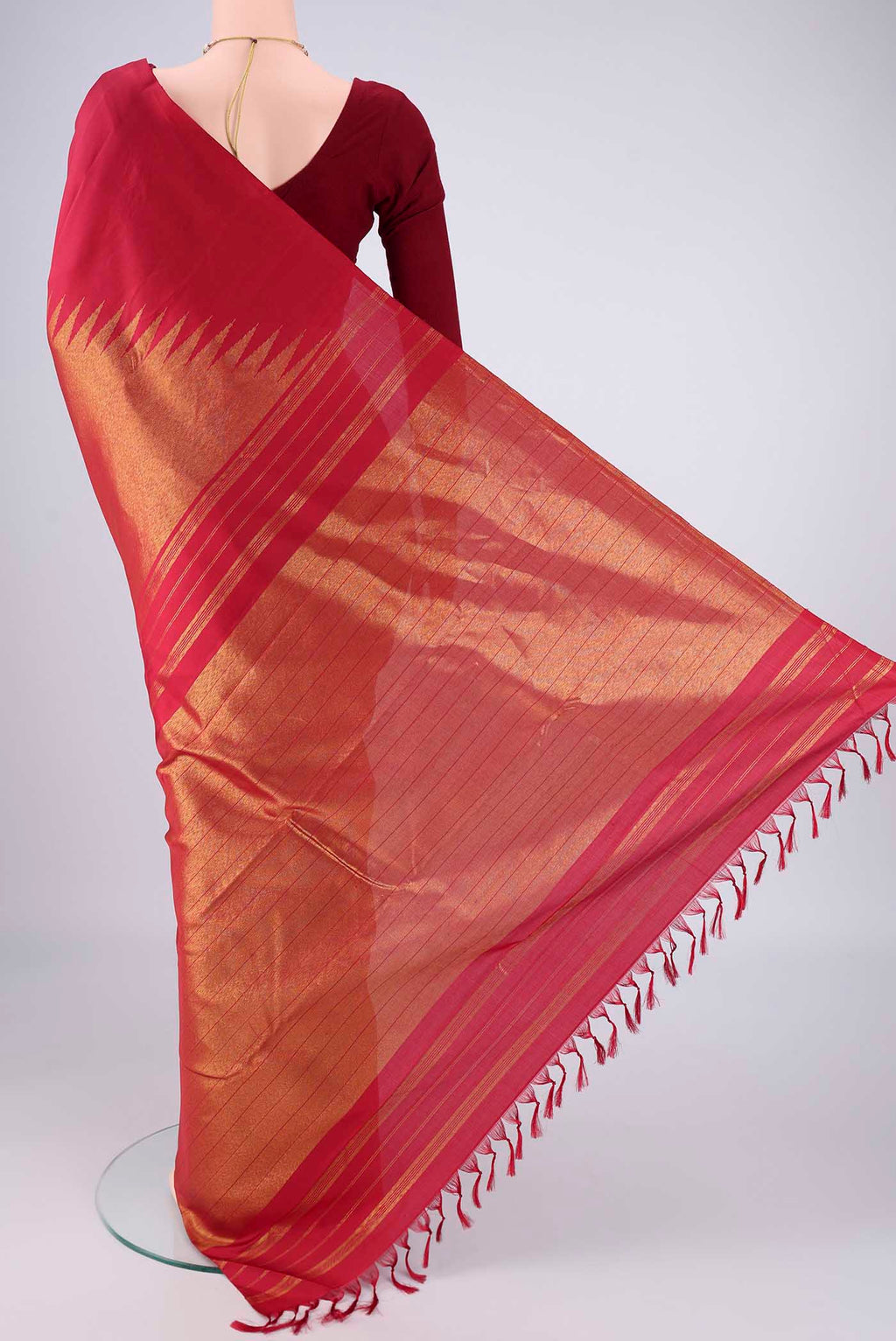Flat view of Maroon Kanjivaram Silk Saree with Plain Body and Rising Temple Border. 