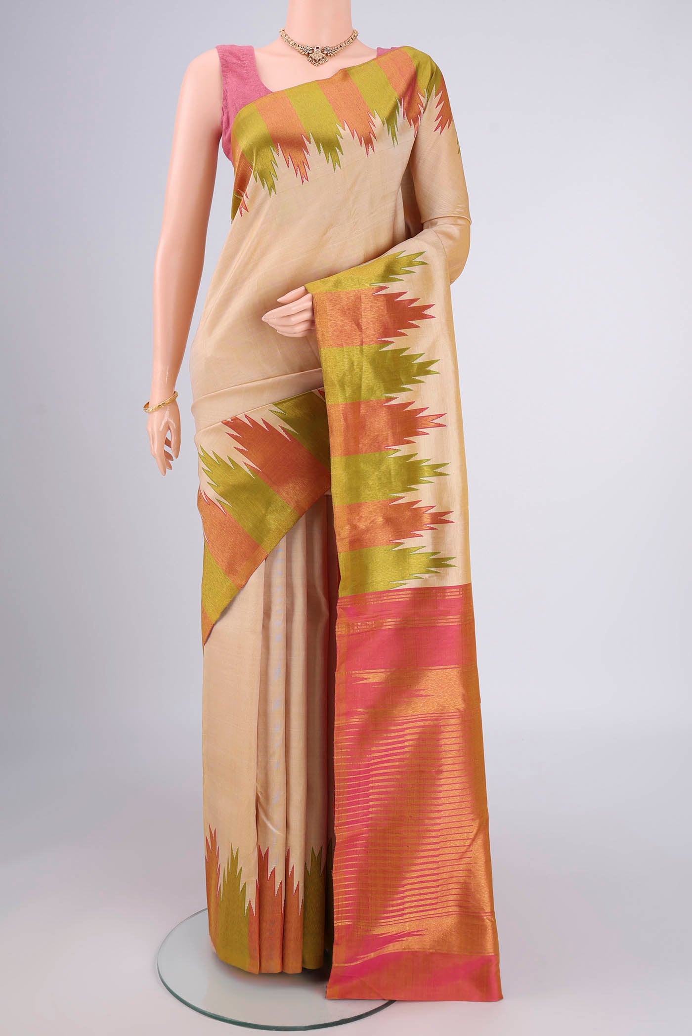 Beige Kanjivaram Silk Saree with Plain Body and Temple Border.  displayed on a mannequin