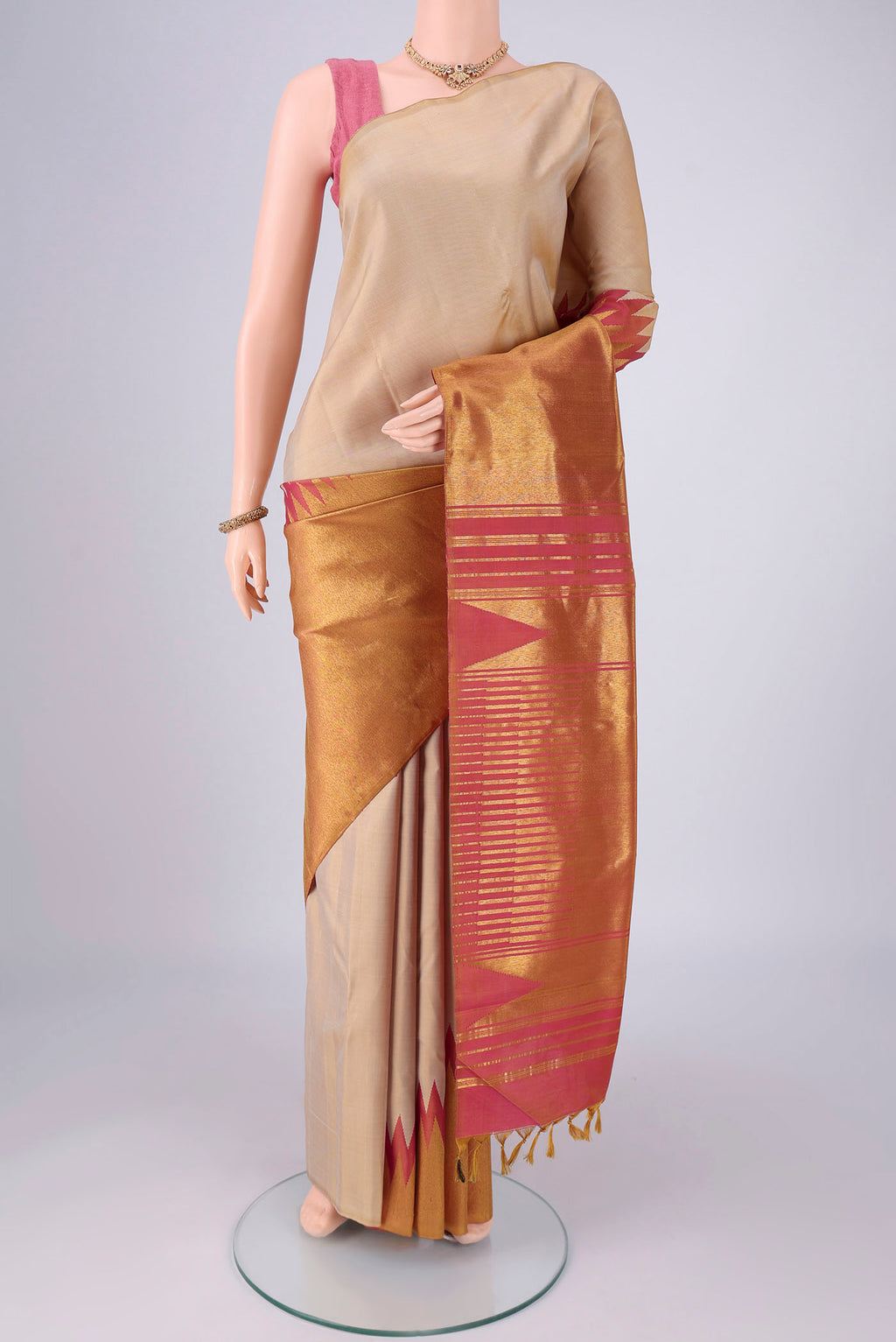 Beige Dual Tone Kanjivaram Silk Saree with Plain Body and Rising Temple Border.  displayed on a mannequin
