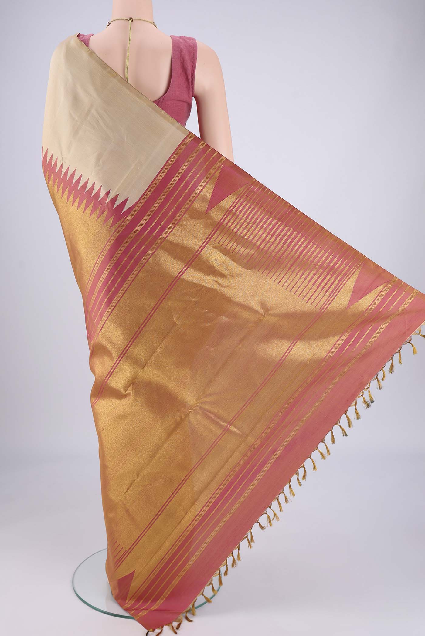 Flat view of Beige Dual Tone Kanjivaram Silk Saree with Plain Body and Rising Temple Border. 