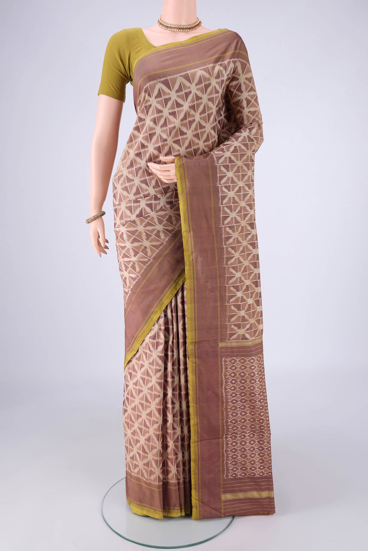 Mauve Pochampally Silk Saree with Ikat design on the body and Plain Border.  displayed on a mannequin
