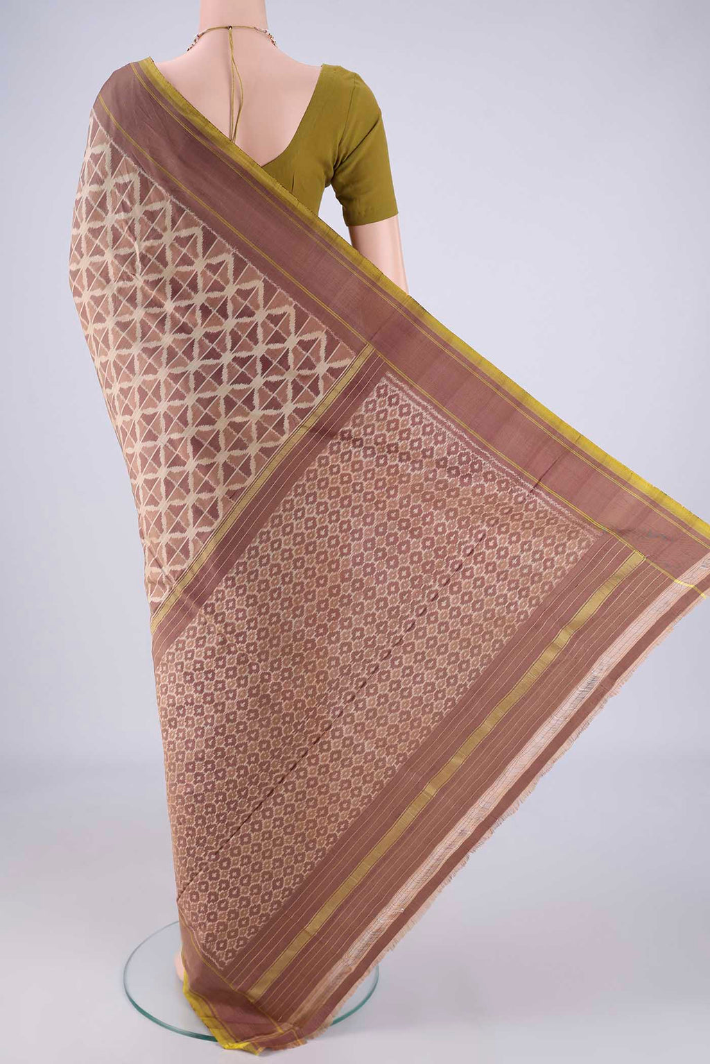 Flat view of Mauve Pochampally Silk Saree with Ikat design on the body and Plain Border. 