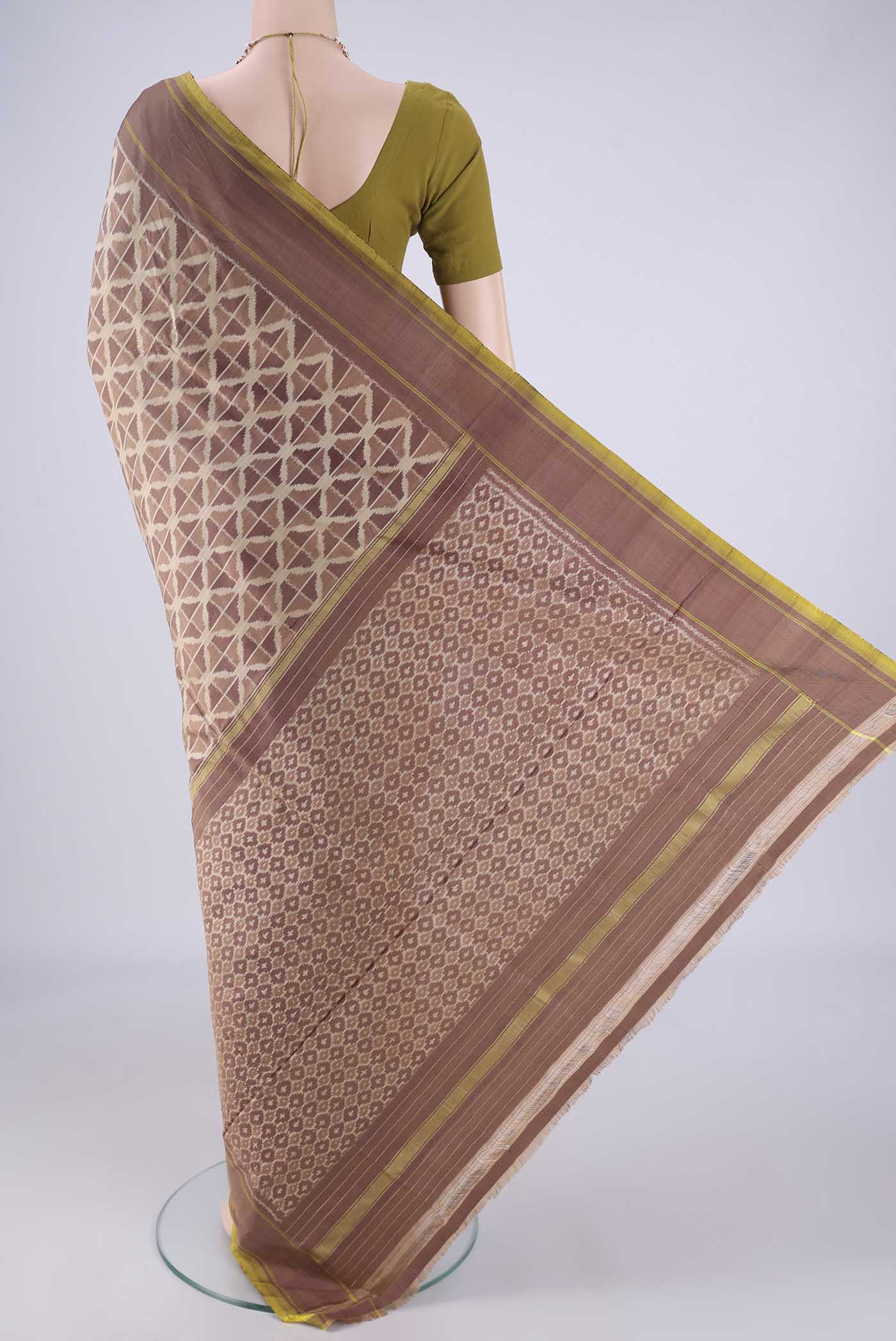 Flat view of Mauve Pochampally Silk Saree with Ikat design on the body and Plain Border. 
