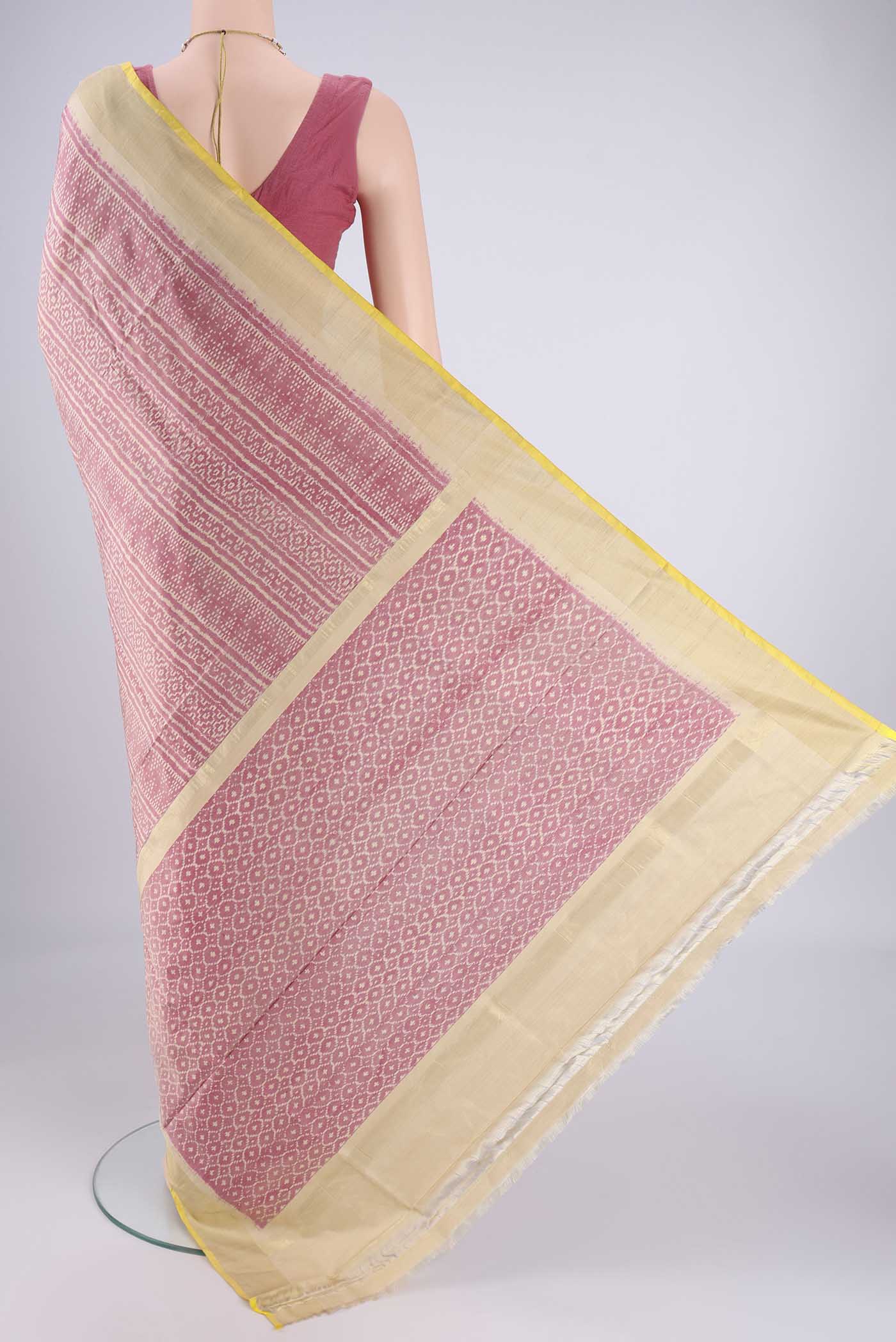 Flat view of Rose Gold Pochampally Silk Saree with Pure Ikat on the body and Zari Border. 