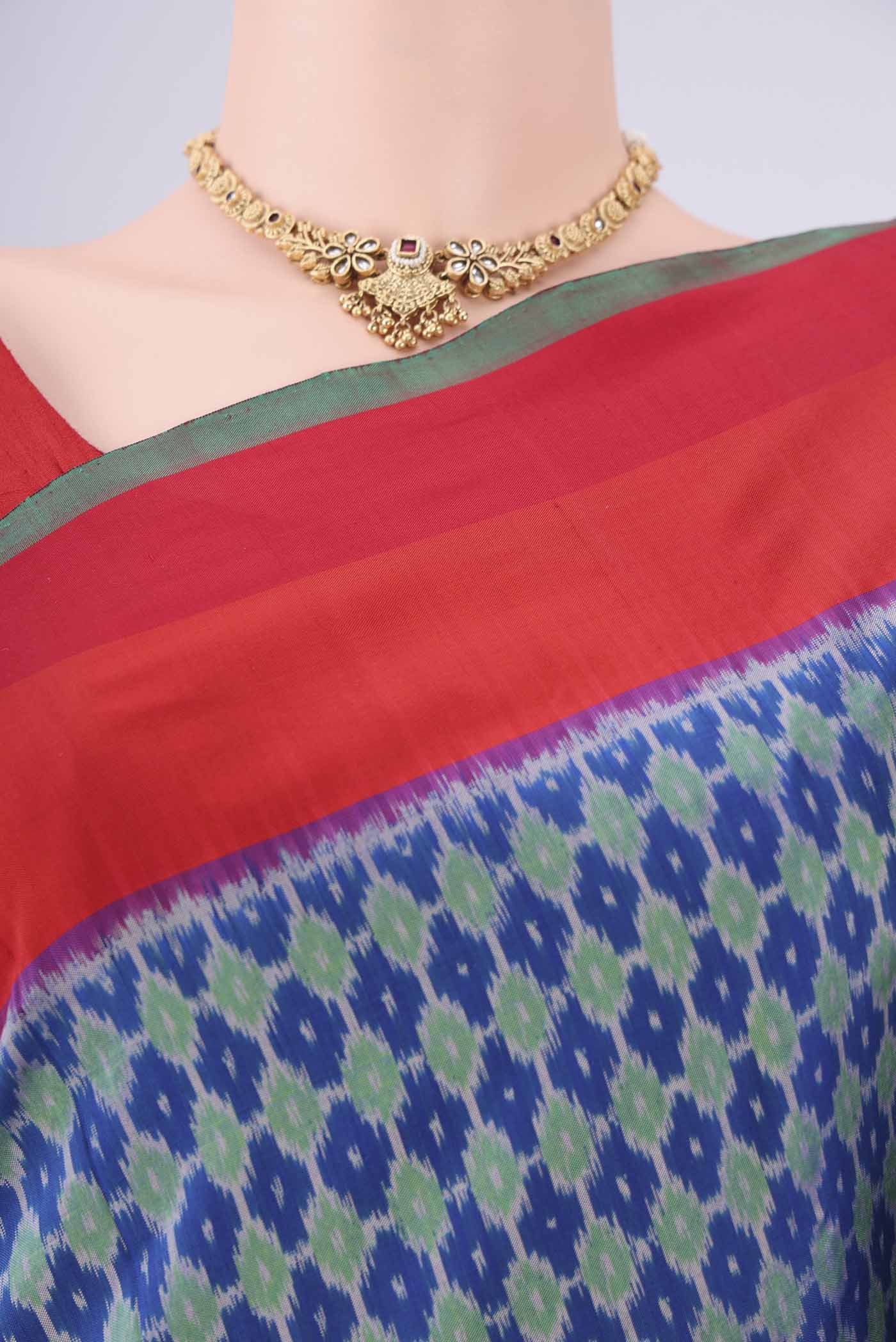 Border image of Blue Pochampally Silk Saree with Ikat design on the body and Zari Border. 