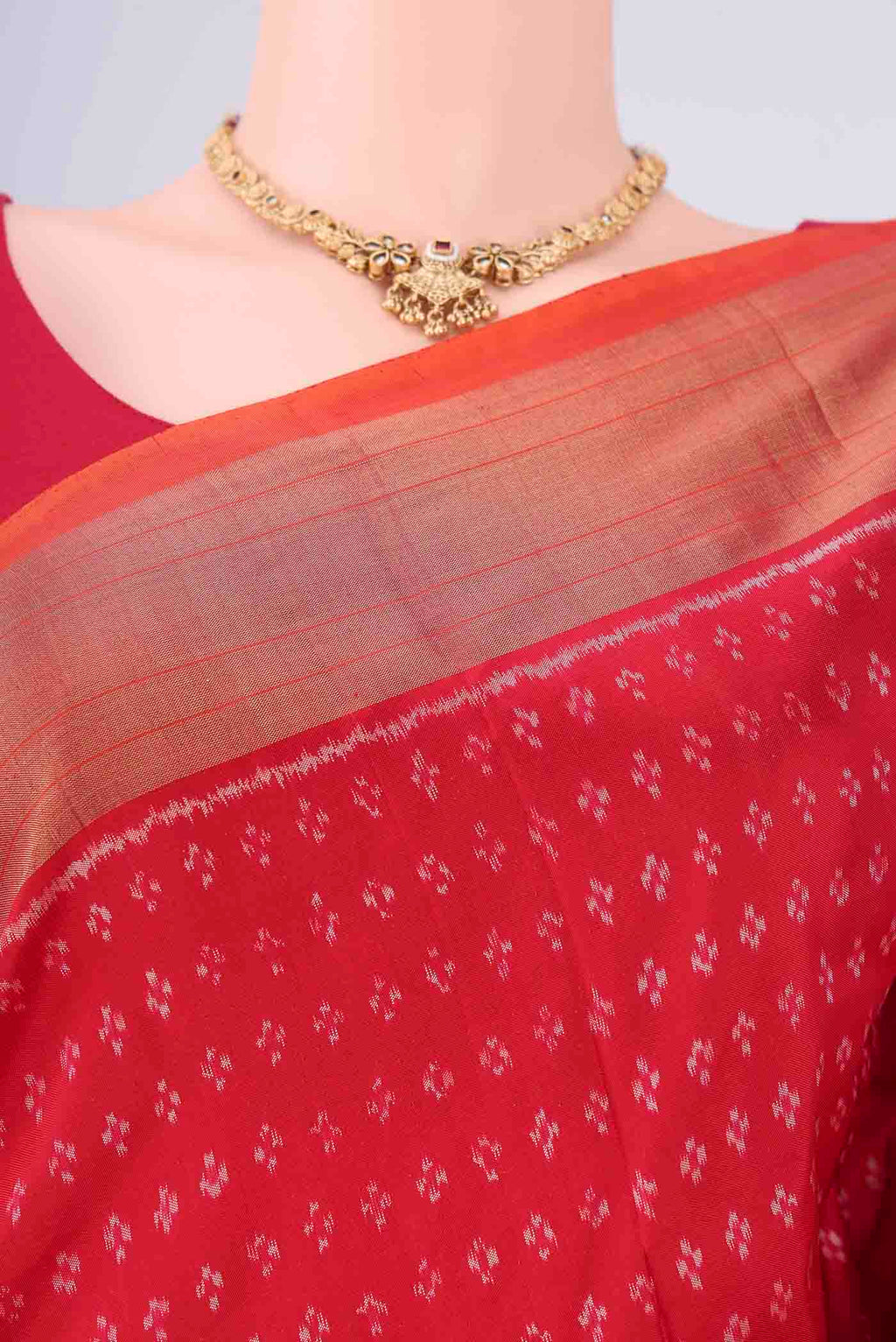 Border image of Red Pochampally Silk Saree with Ikat design on the body and Zari Border. 