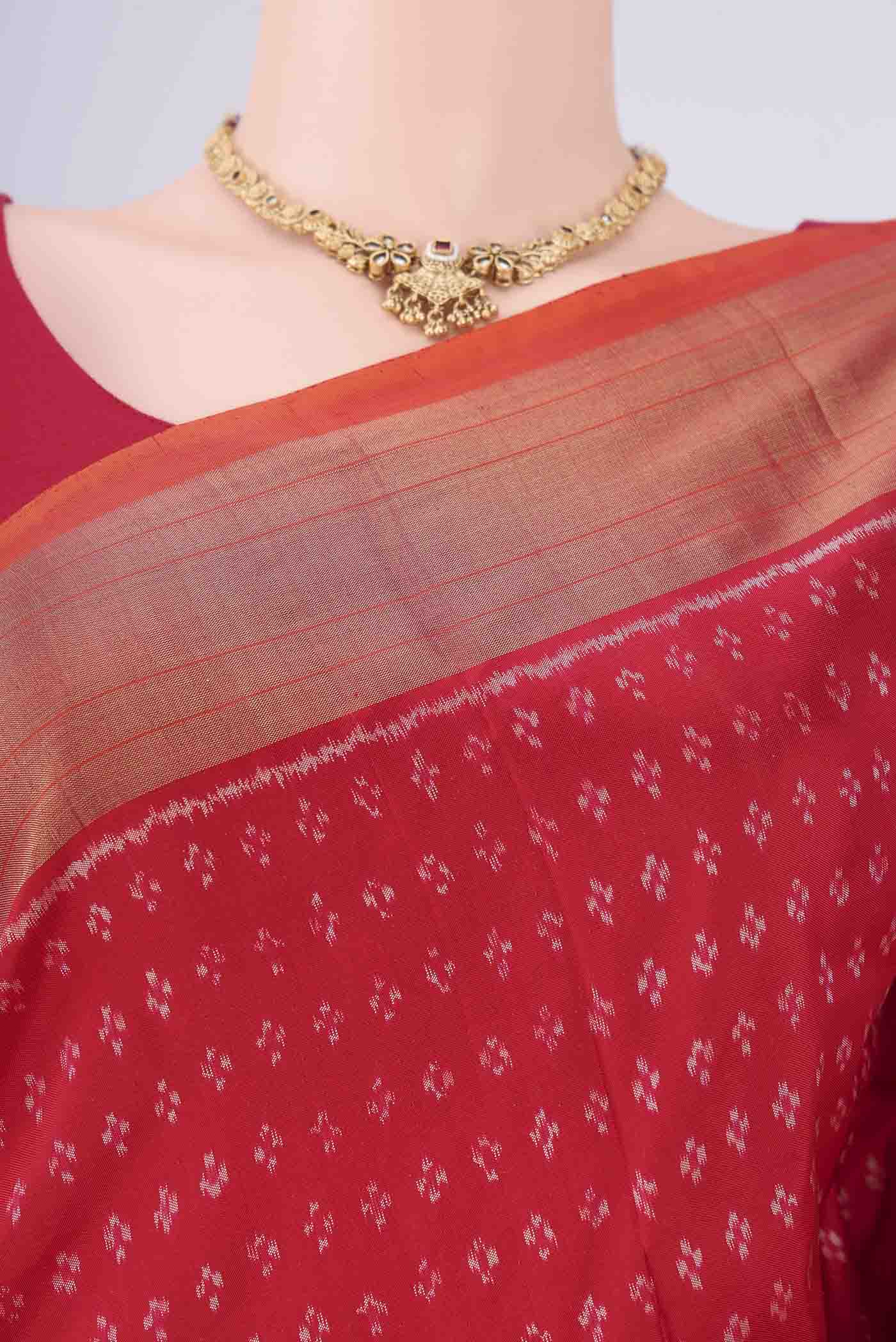 Border image of Red Pochampally Silk Saree with Ikat design on the body and Zari Border. 