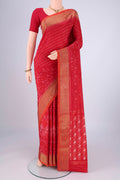 Red Pochampally Silk Saree with Ikat design on the body and Zari Border.  displayed on a mannequin