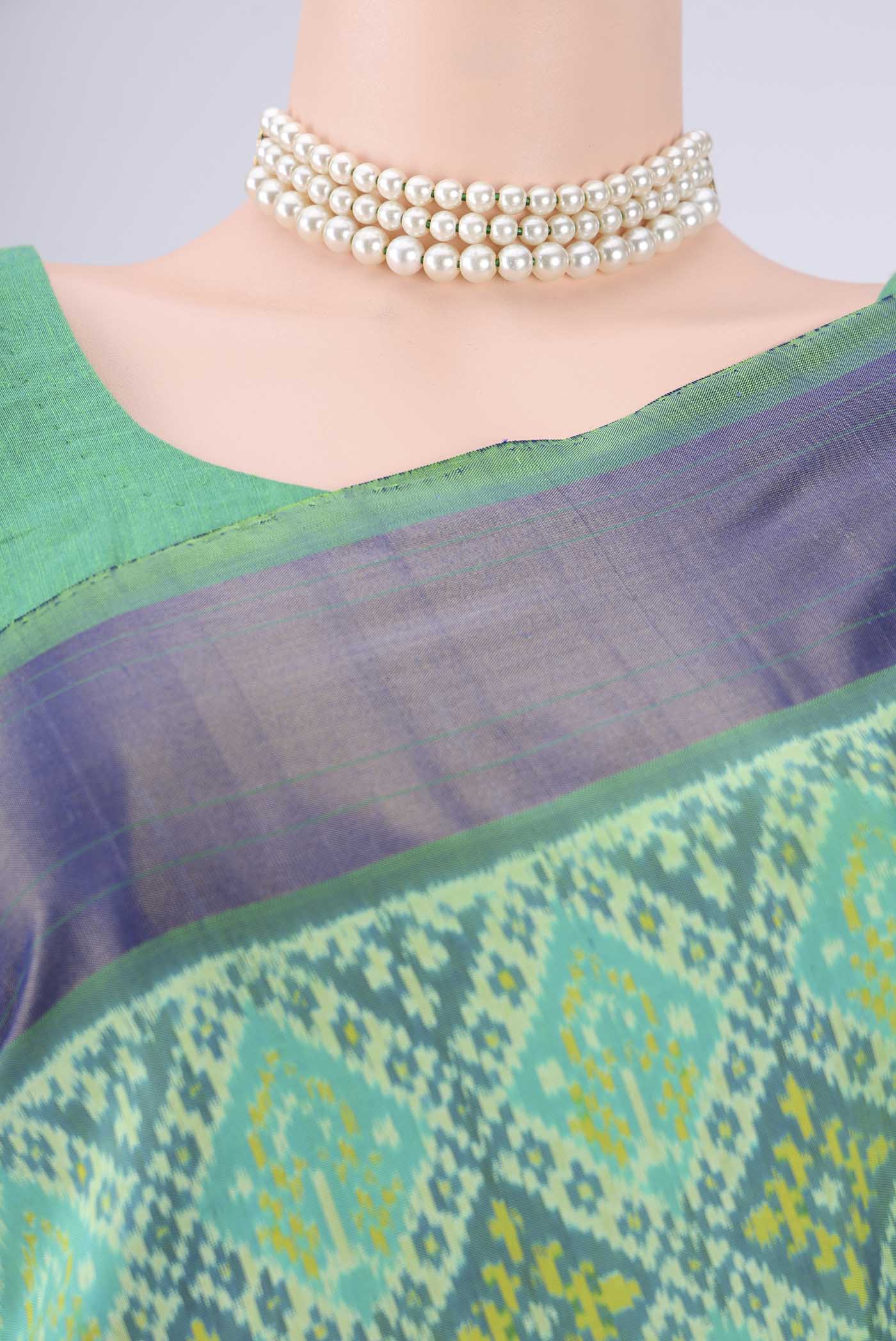 Border image of Sea Green Pochampally Silk Saree with Ikat design on the body and Zari Border. 
