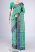Sea Green Pochampally Silk Saree with Ikat design on the body and Zari Border.  displayed on a mannequin