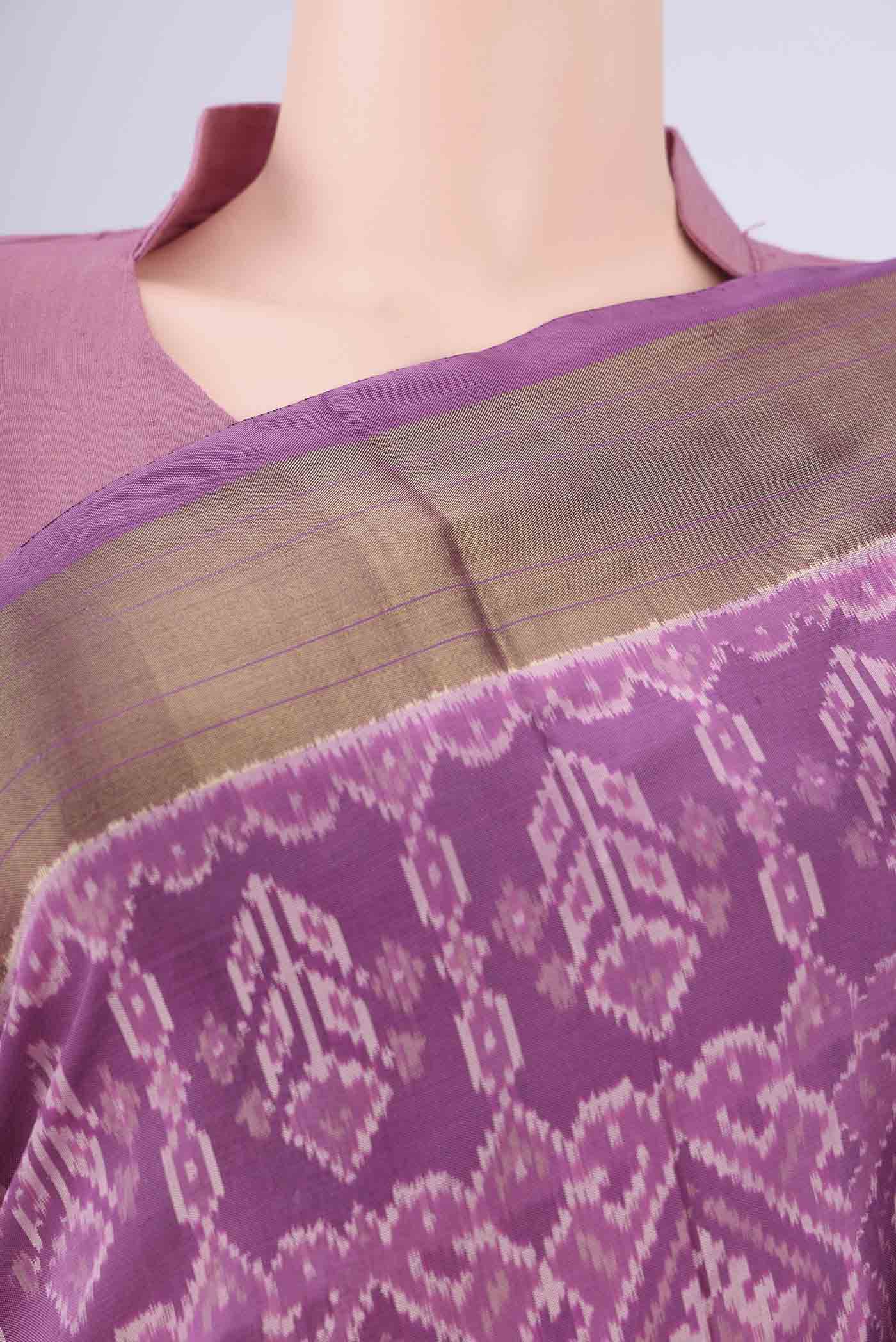 Border image of Purple Pochampally Silk Saree with Ikat design on the body and Zari Border. 