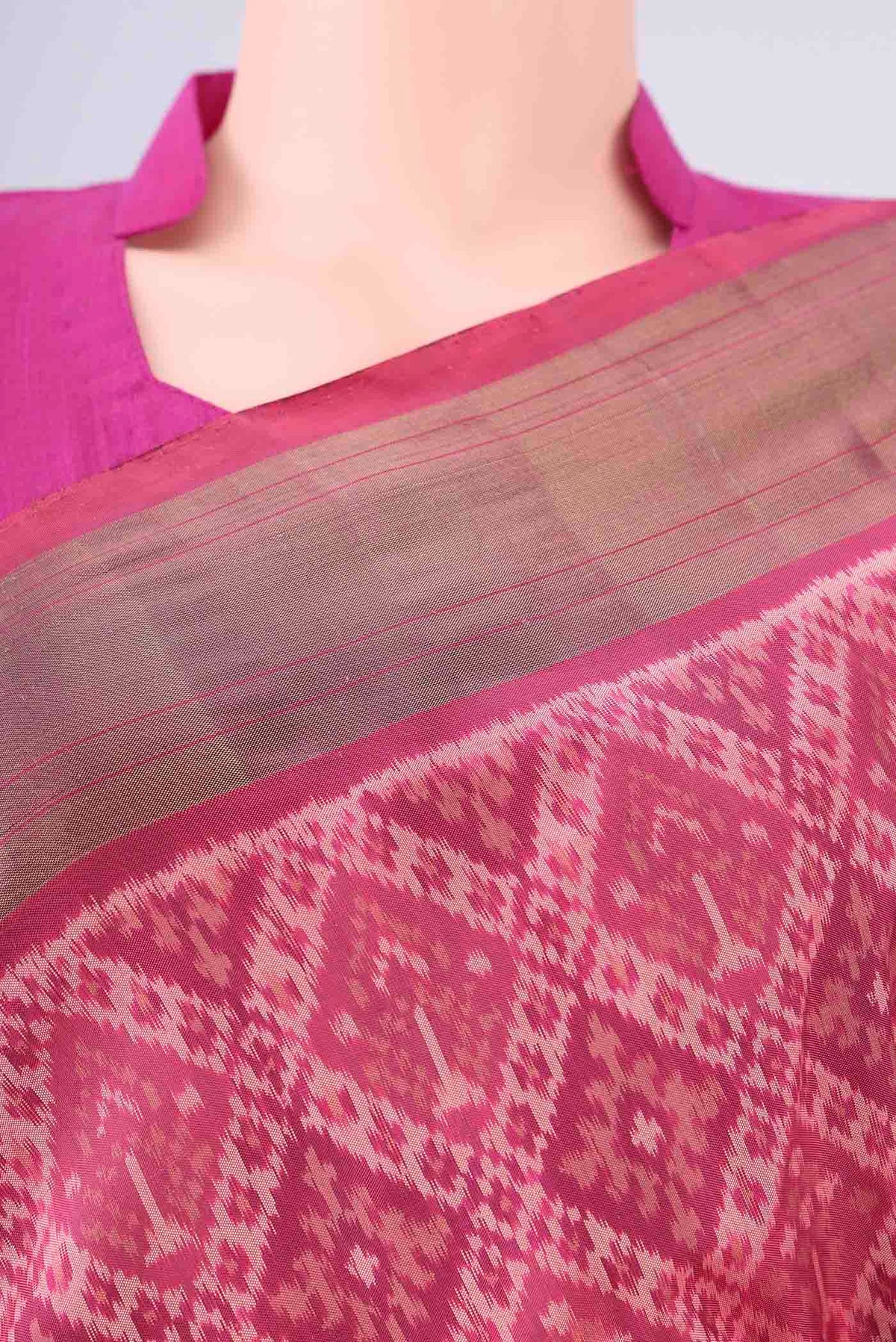 Border image of Rose Gold Pochampally Silk Saree with Ikat design on the body and Zari Border. 