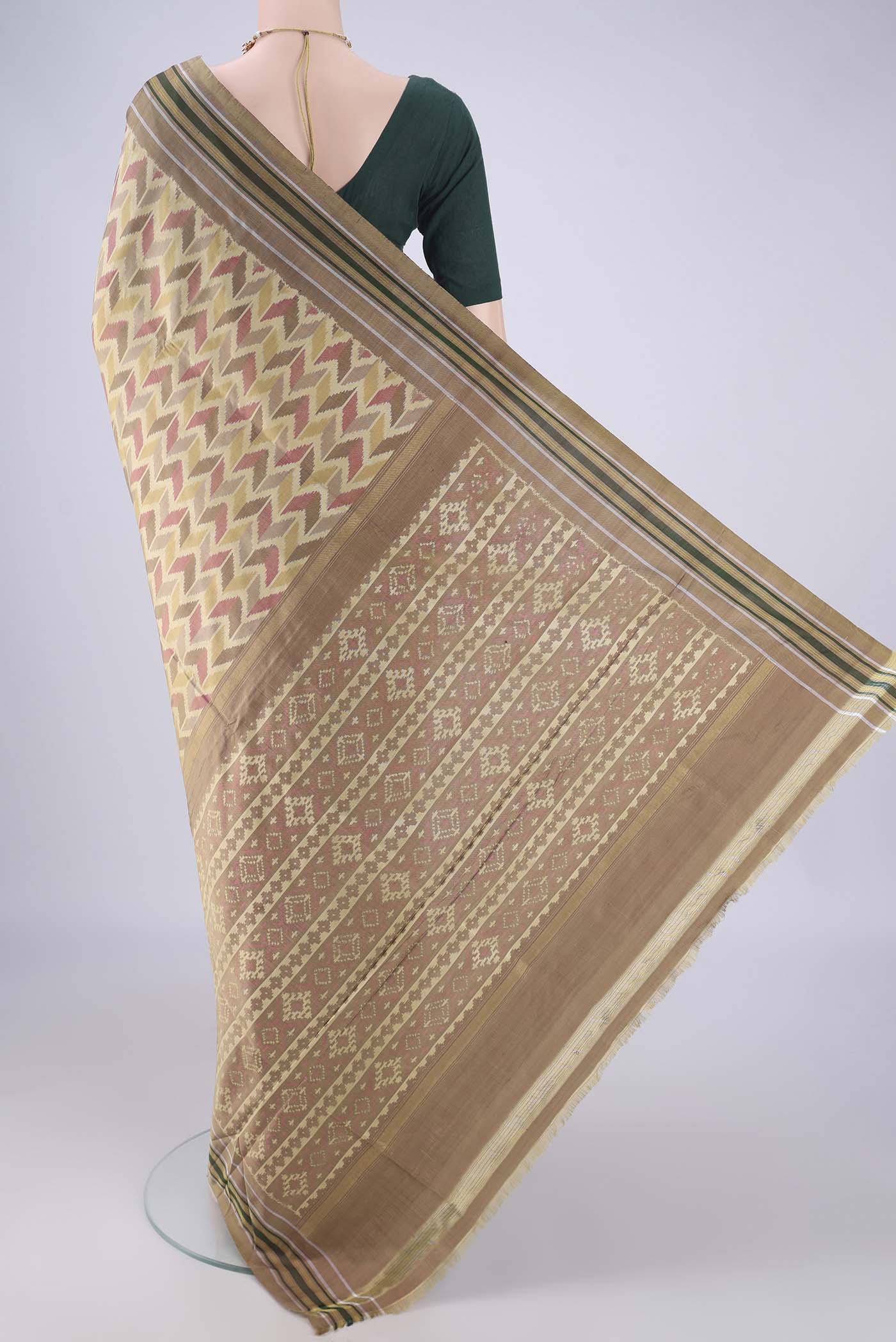Flat view of Beige Pochampally Silk Saree with Pure Ikat on the body and Plain Border. 