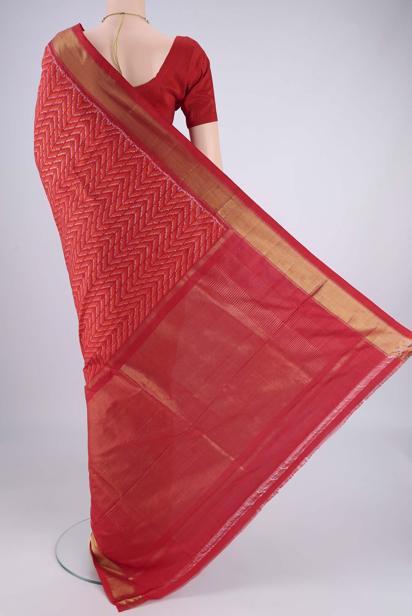 Flat view of Red Pochampally Silk Saree with Pure Ikat on the body and Zari Border. 