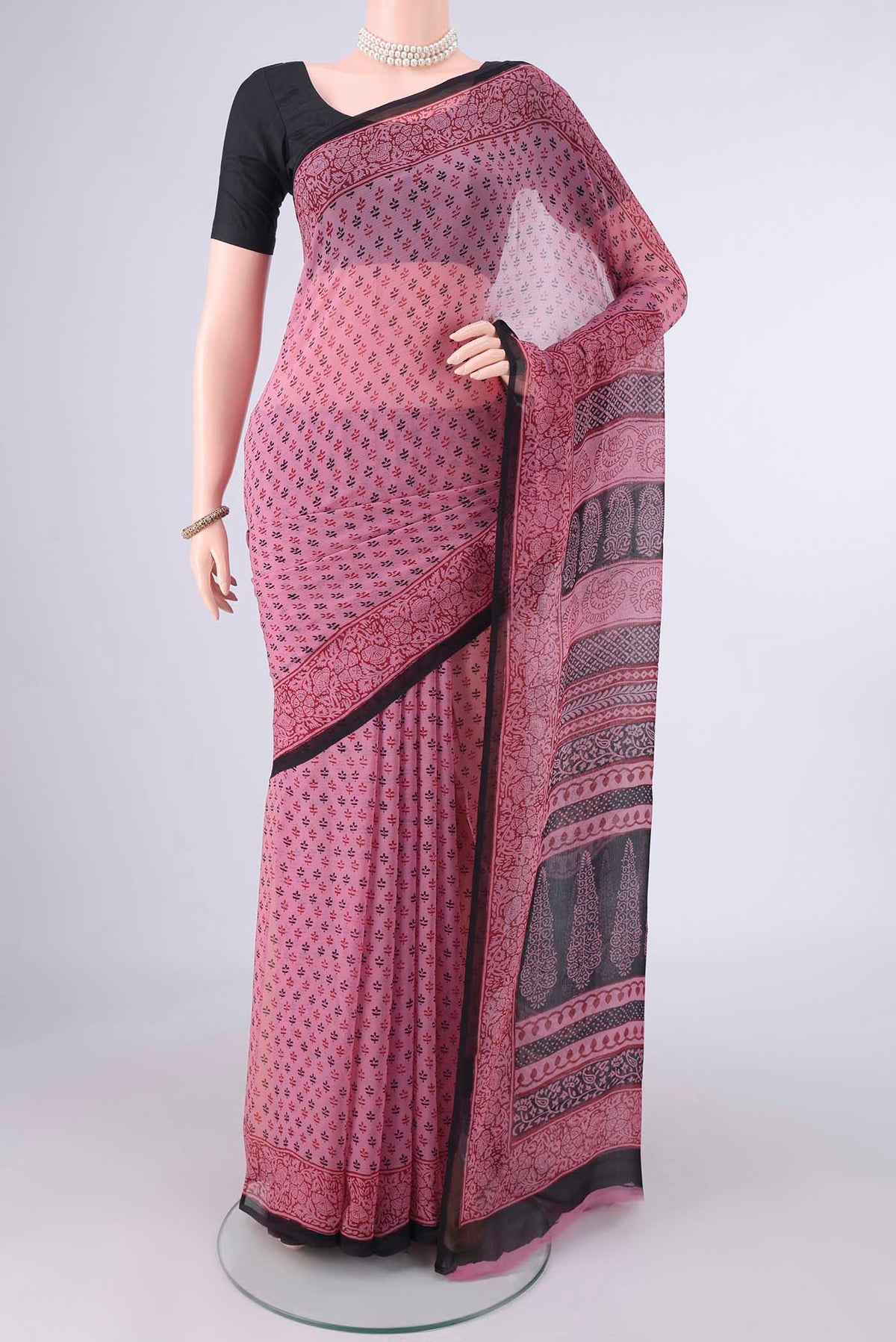 Pink Mysore Chiffon Saree with Floral Print on the body and Printed Border.  displayed on a mannequin