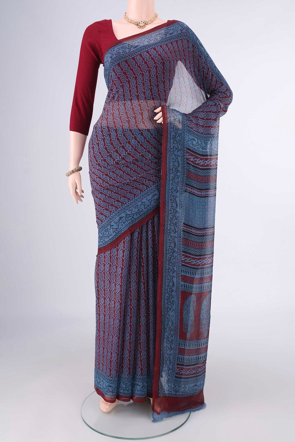 Maroon Mysore Chiffon Saree with Floral Print on the body and Printed Border.  displayed on a mannequin