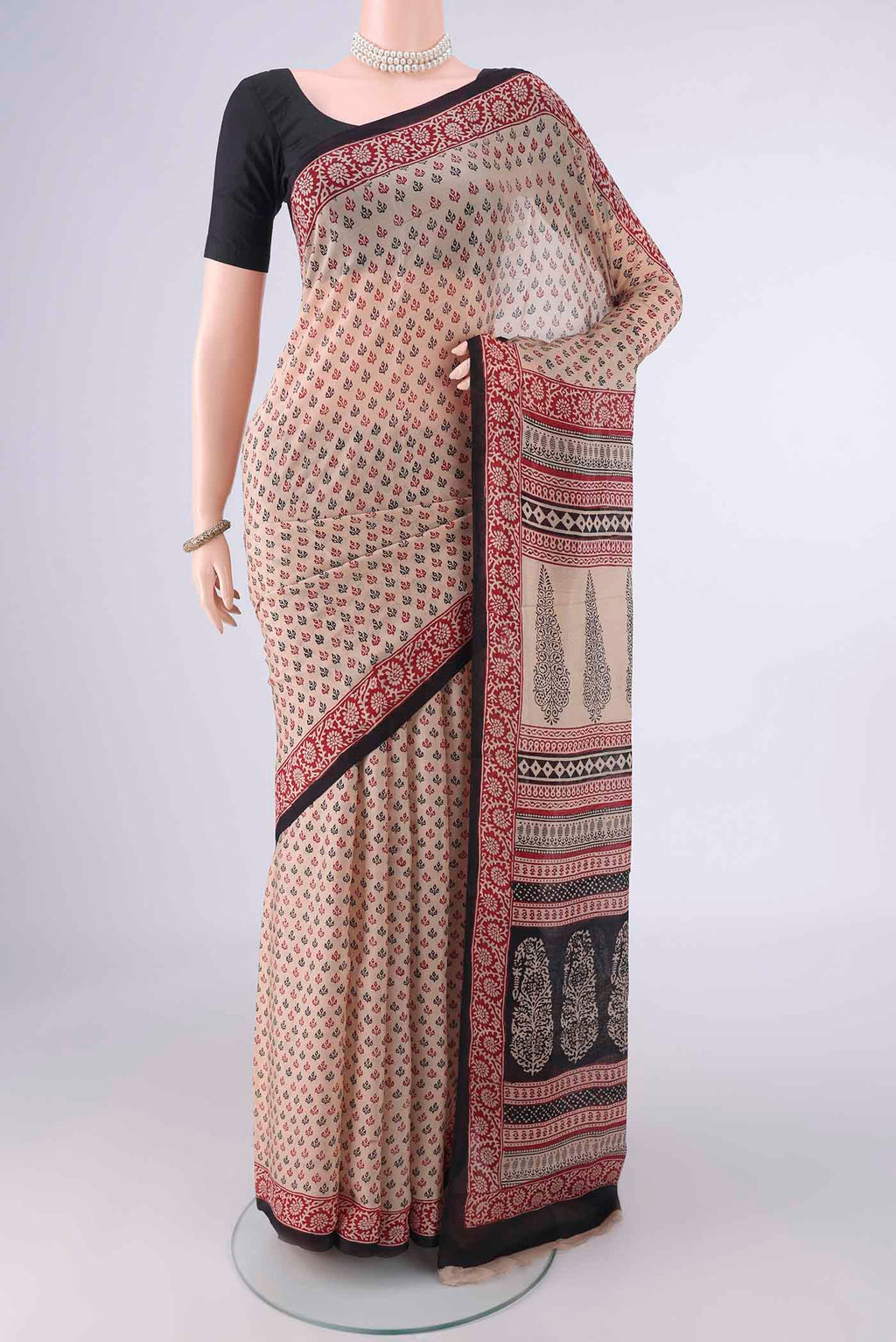 Beige Mysore Chiffon Saree with Printed design on the body and Printed Border.  displayed on a mannequin