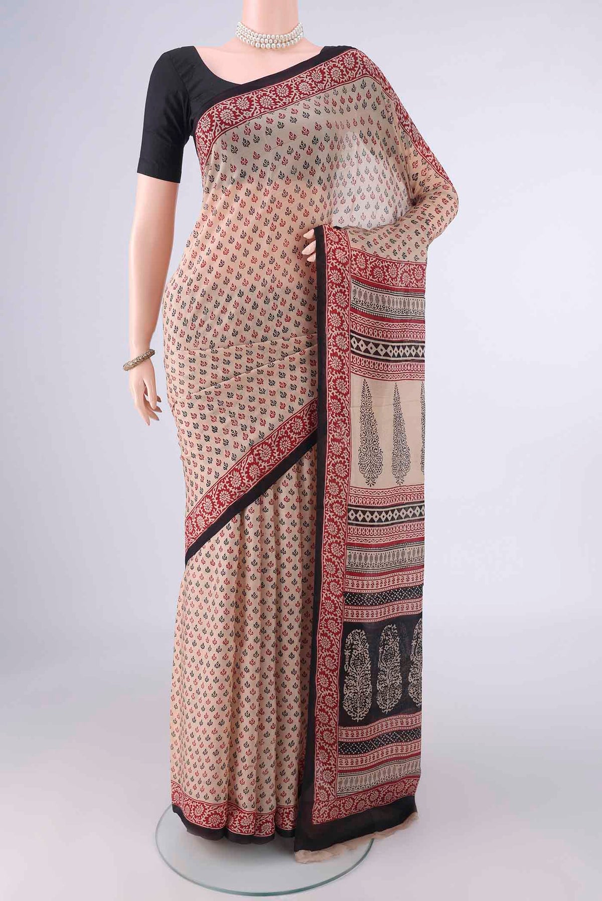 Beige Mysore Chiffon Saree with Printed design on the body and Printed Border.  displayed on a mannequin