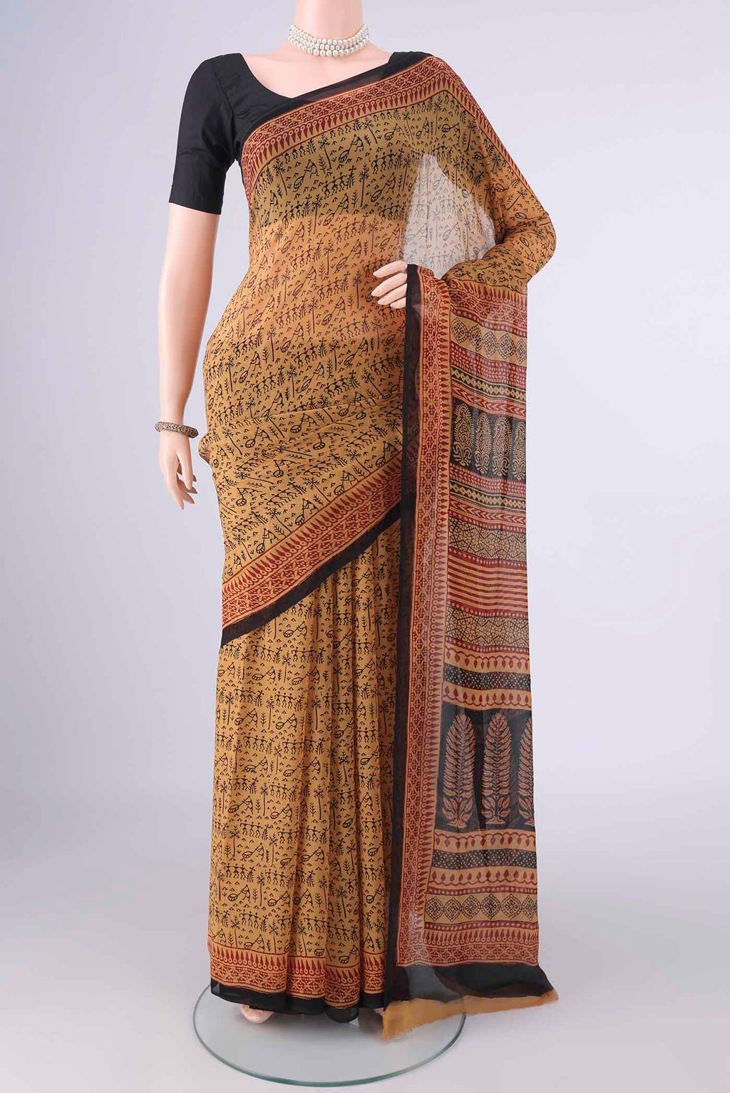 Mustard Mysore Chiffon Saree with Printed design on the body and Printed Border.  displayed on a mannequin