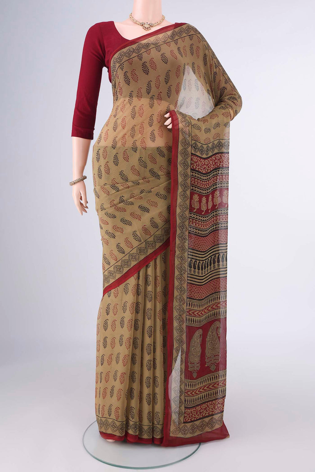 Beige Mysore Chiffon Saree with Floral Print on the body and Printed Border.  displayed on a mannequin
