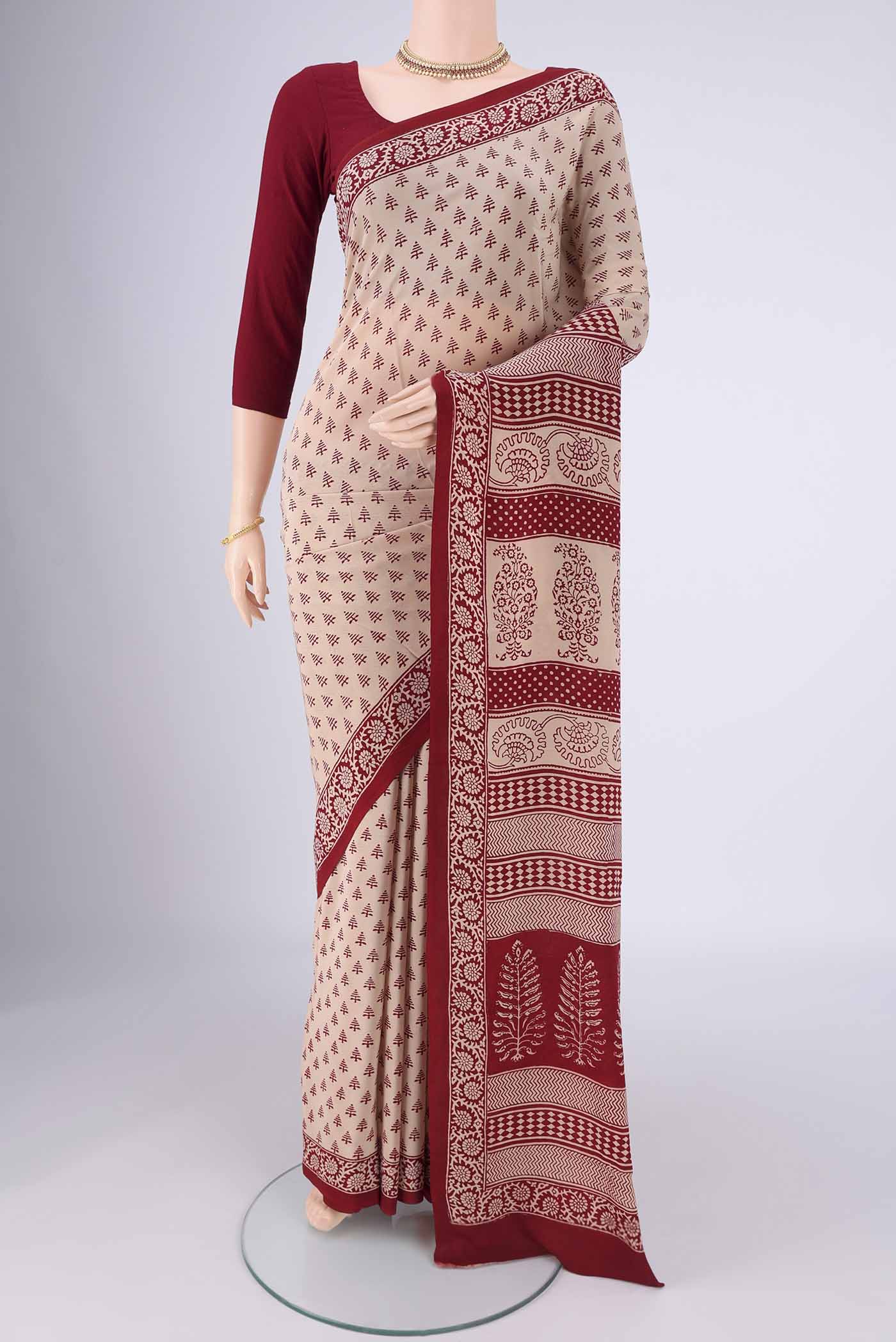 Beige Mysore Crepe Saree with Printed design on the body and Printed Border.  displayed on a mannequin