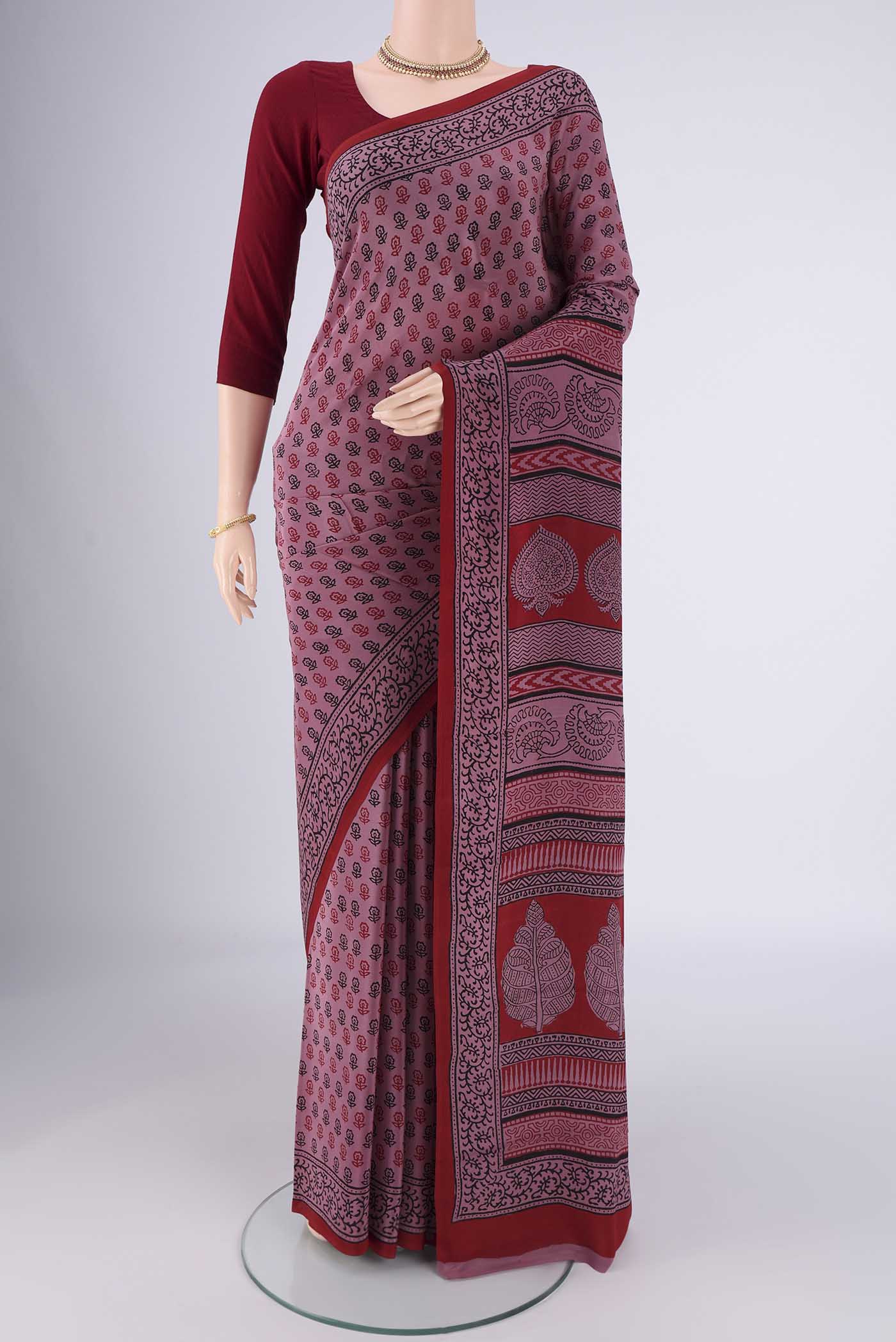 Dark Mauve Mysore Crepe Saree with Printed design on the body and Printed Border.  displayed on a mannequin