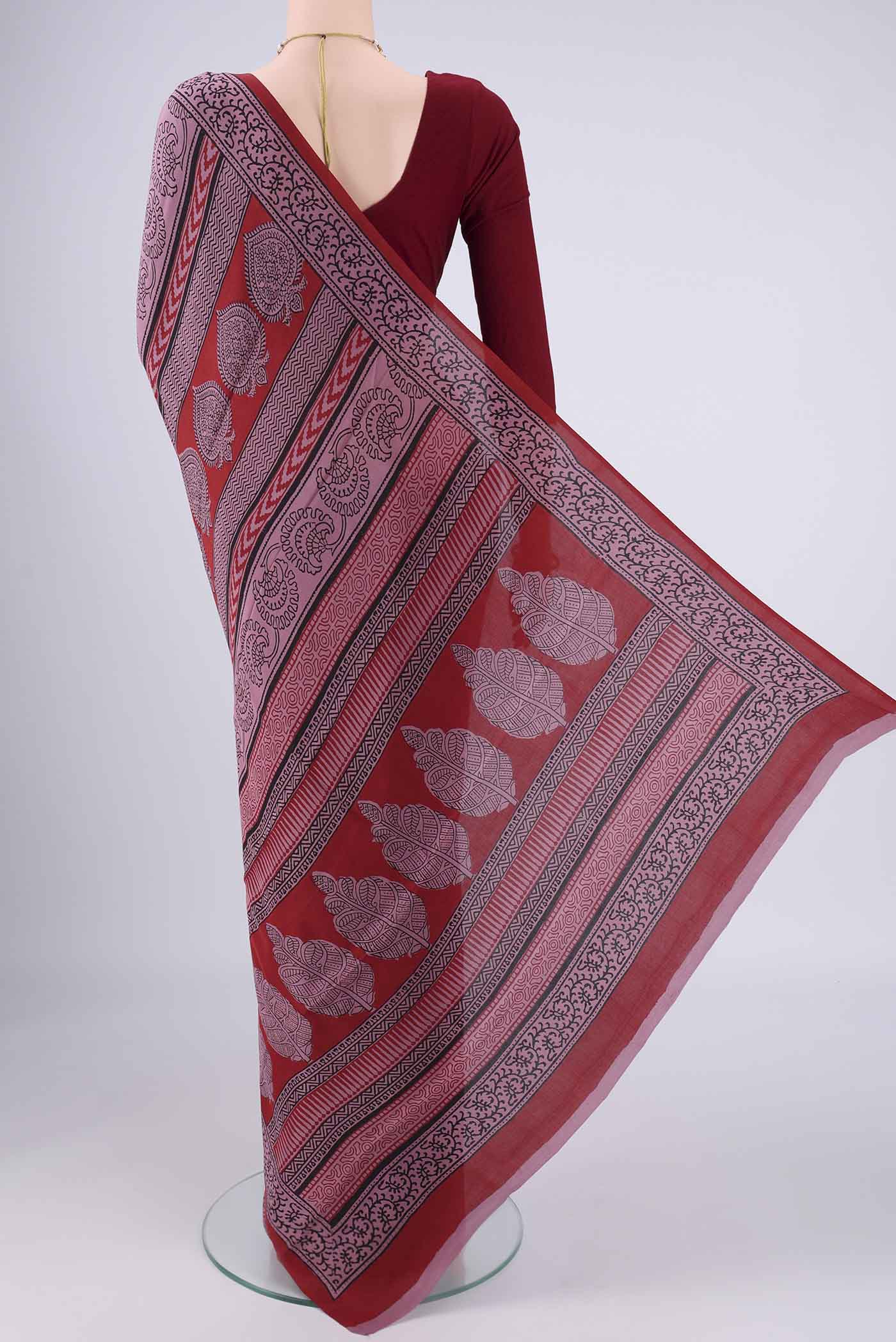Flat view of Dark Mauve Mysore Crepe Saree with Printed design on the body and Printed Border. 