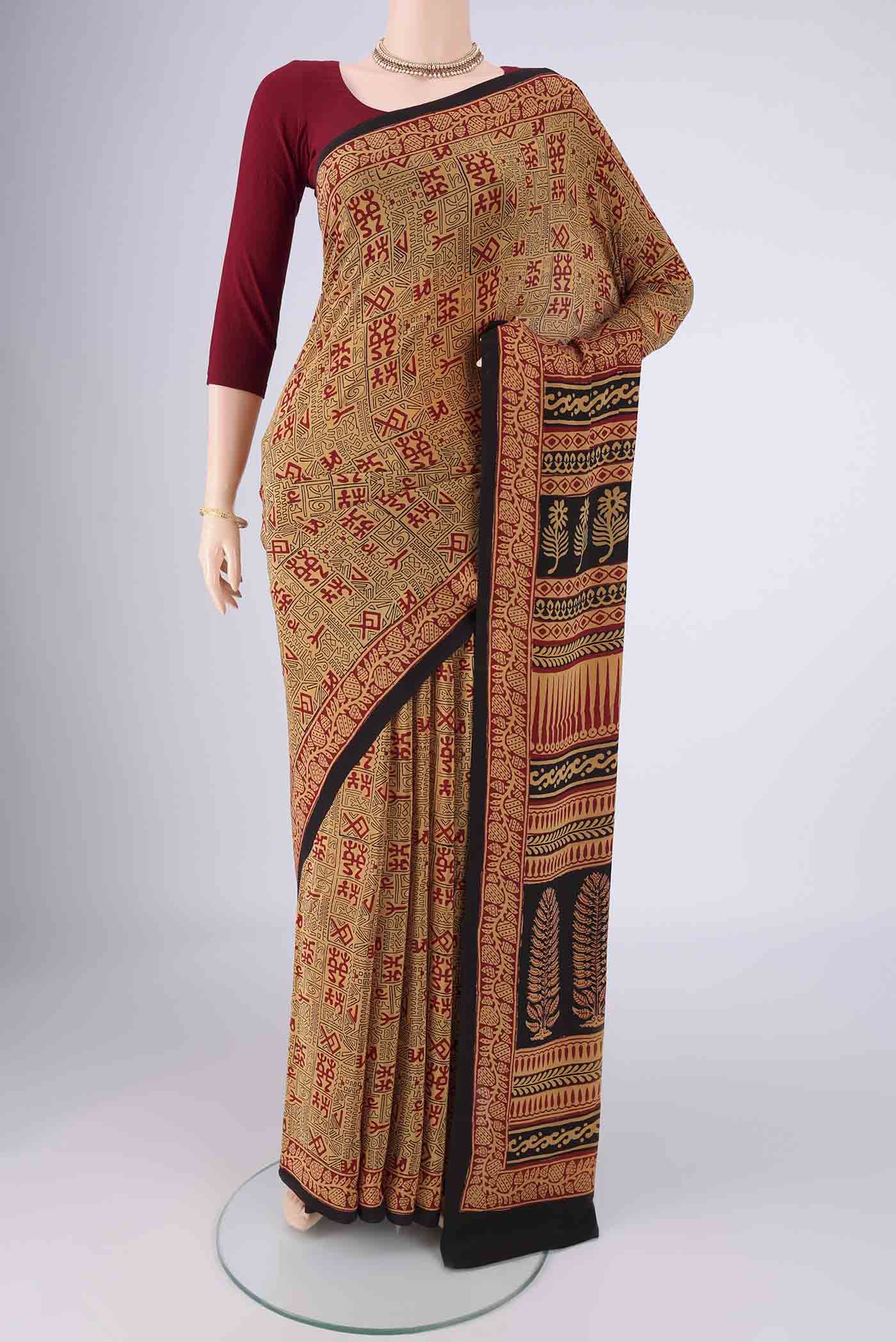 Sandal Mysore Crepe Saree with Geometric Print on the body and Printed Border.  displayed on a mannequin