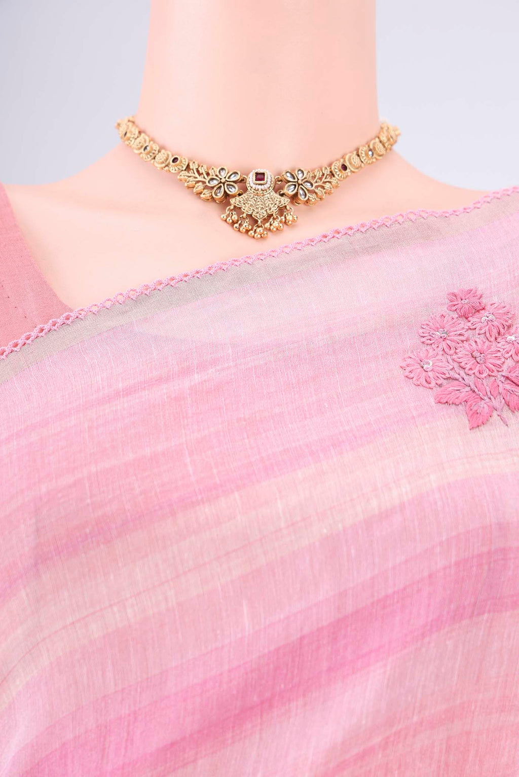 Border image of Pink Linen Saree with Embroidery on the body and Lace Border. 