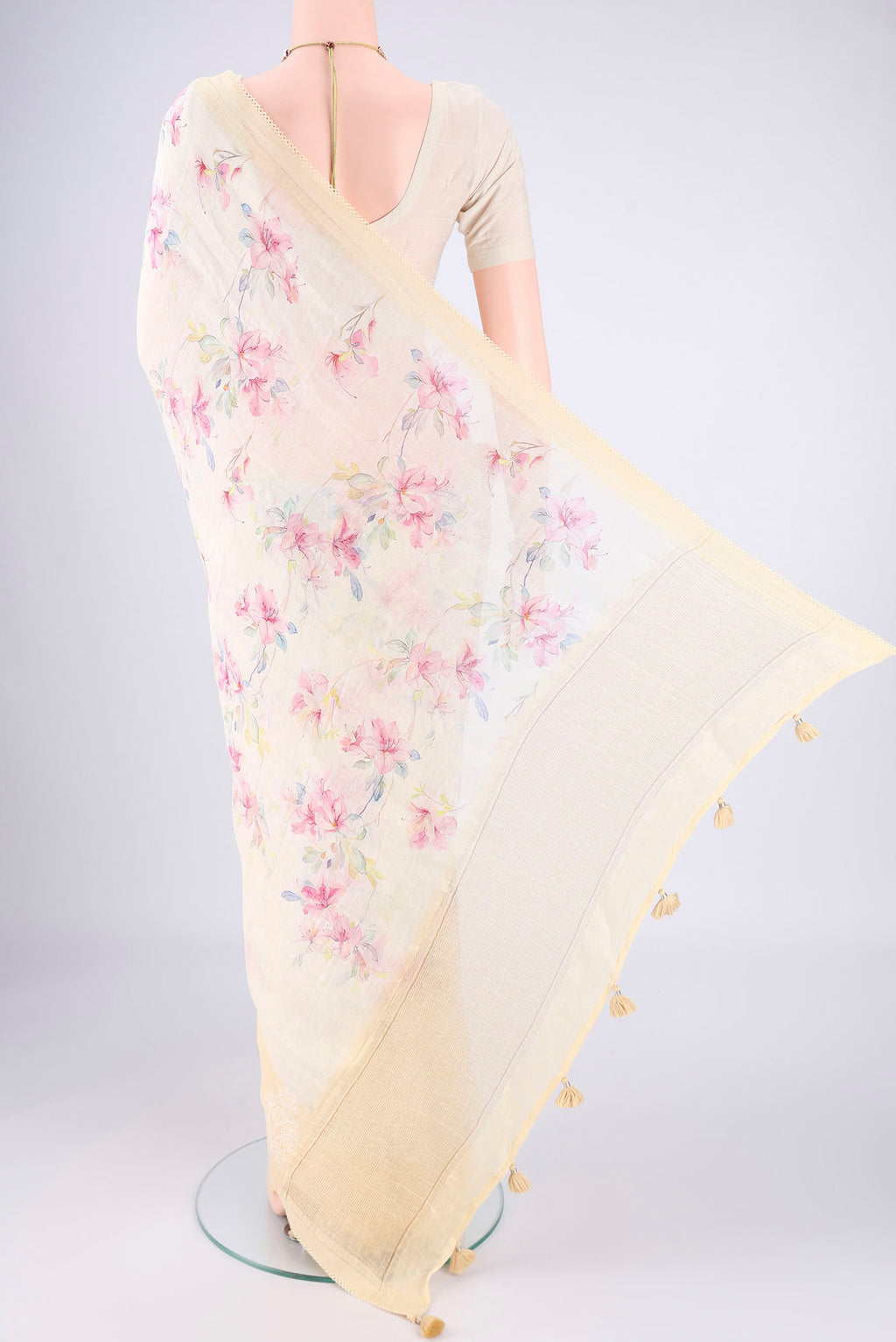 Flat view of Lemon Yellow Linen Saree with Printed design on the body and Lace Border. 