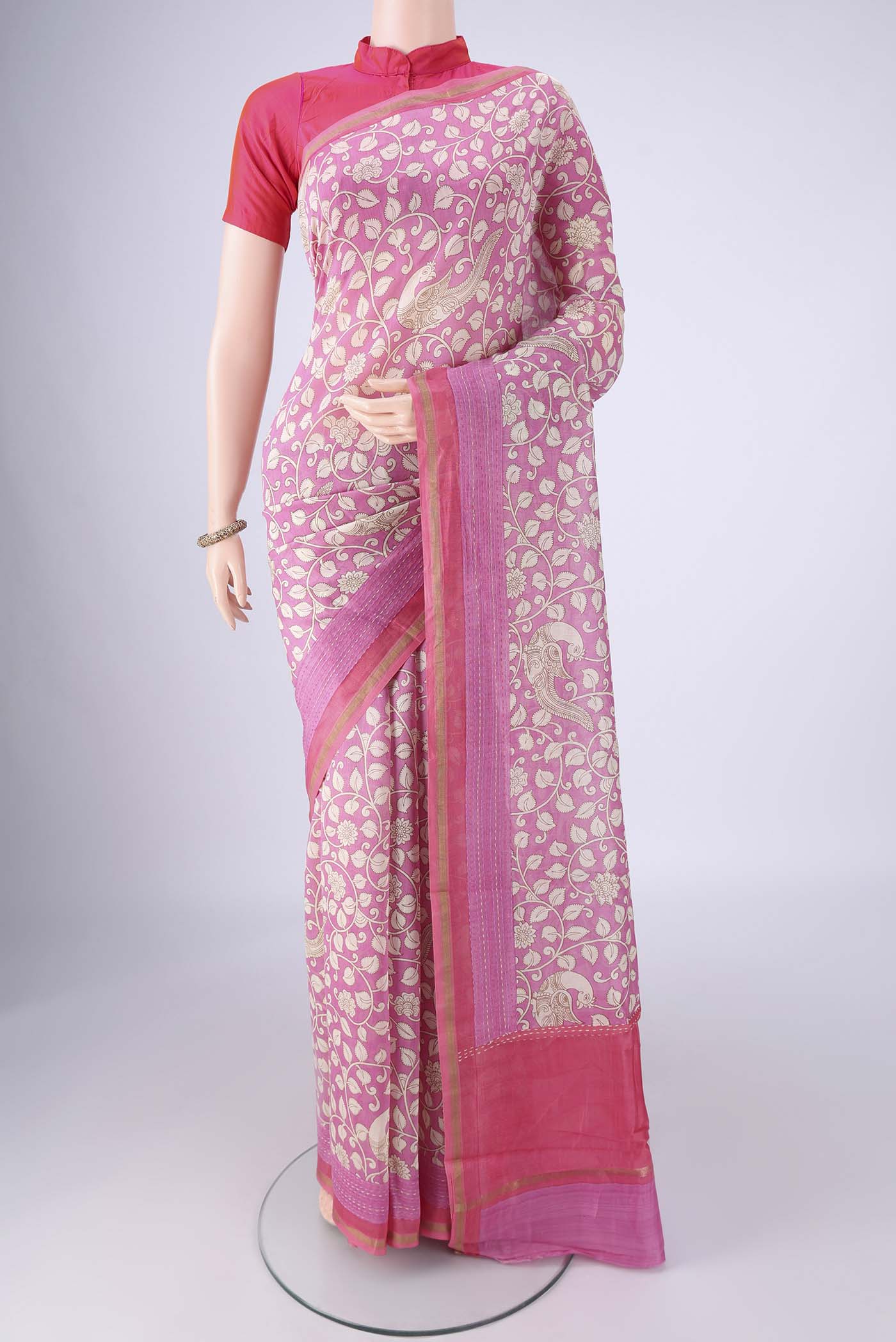 Rose pink Chanderi Silk Cotton Saree with Printed design on the body and Zari Border.  displayed on a mannequin