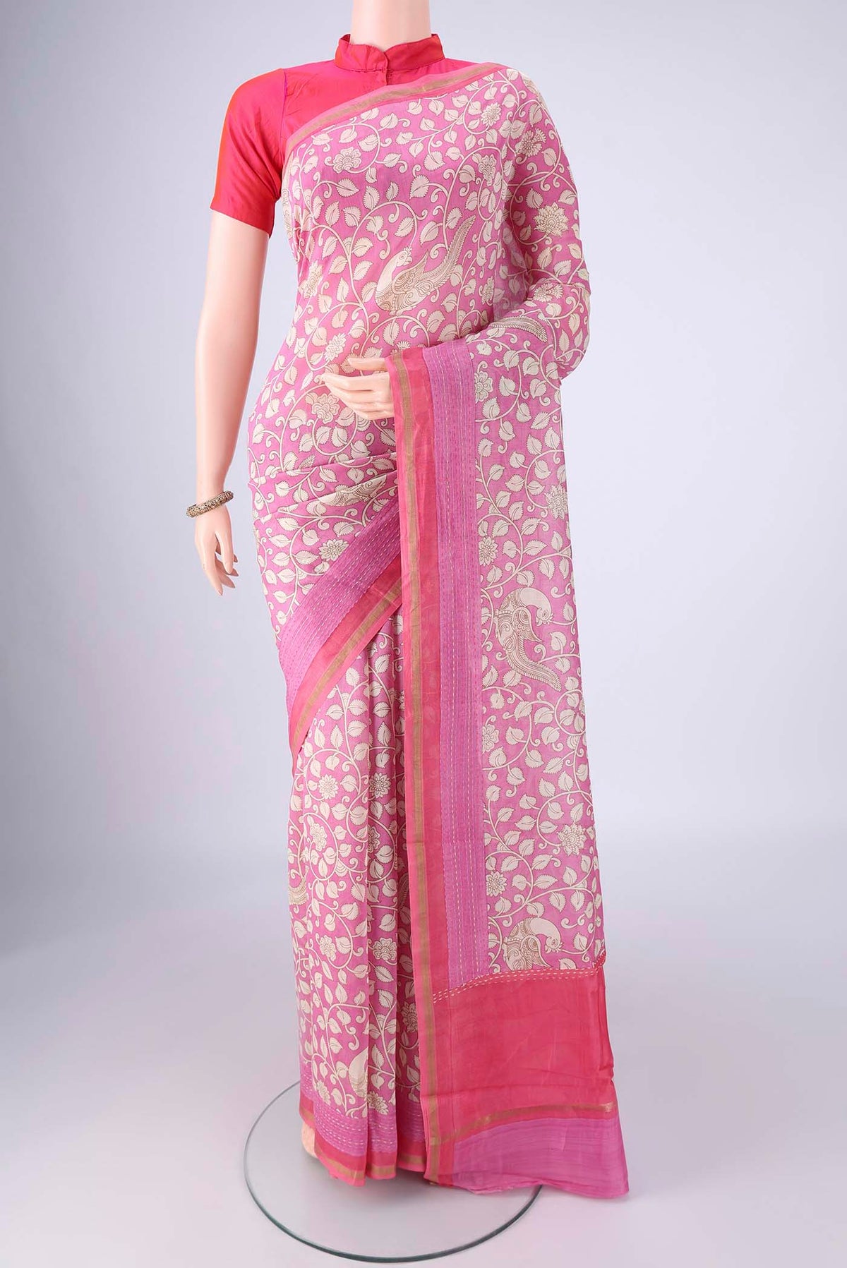 Rose pink Chanderi Silk Cotton Saree with Printed design on the body and Zari Border.  displayed on a mannequin