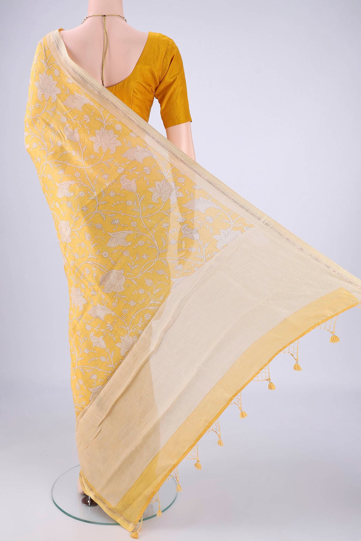 Flat view of Lemon Yellow Chanderi Silk Cotton Saree with Printed design on the body and Zari And Thread Border. 