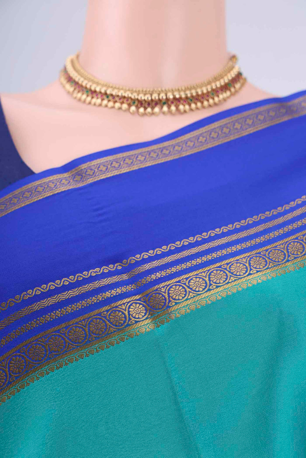 Border image of Turquoise Mysore Crepe Saree with Plain Body and Zari Border. 