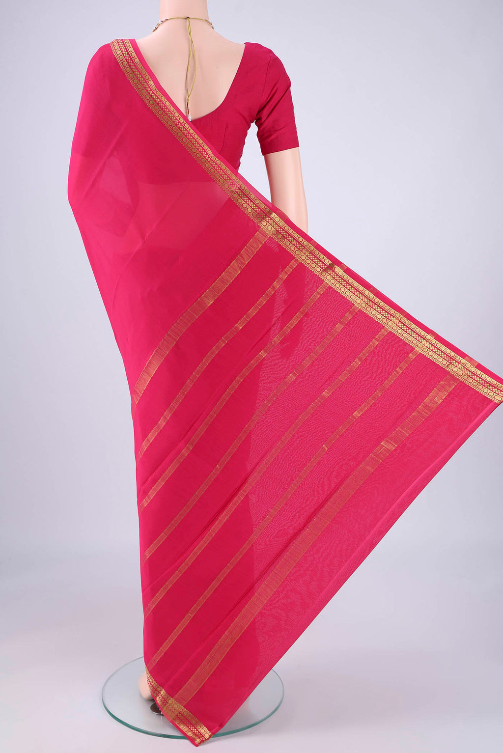 Flat view of Rani Pink Mysore Crepe Saree with Plain Body and Zari Border. 