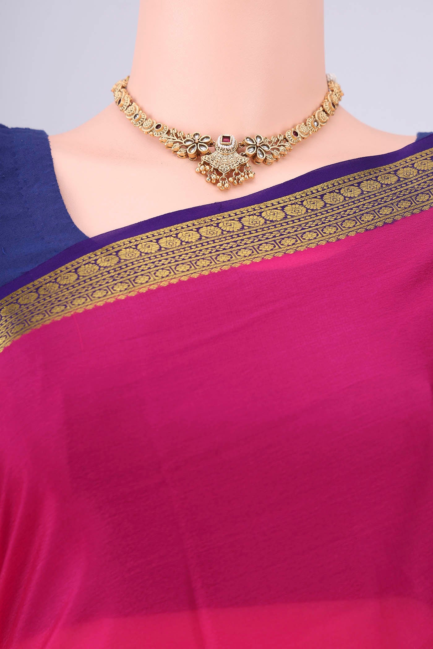 Border image of Rani Pink Mysore Crepe Saree with Plain Body and Zari Border. 