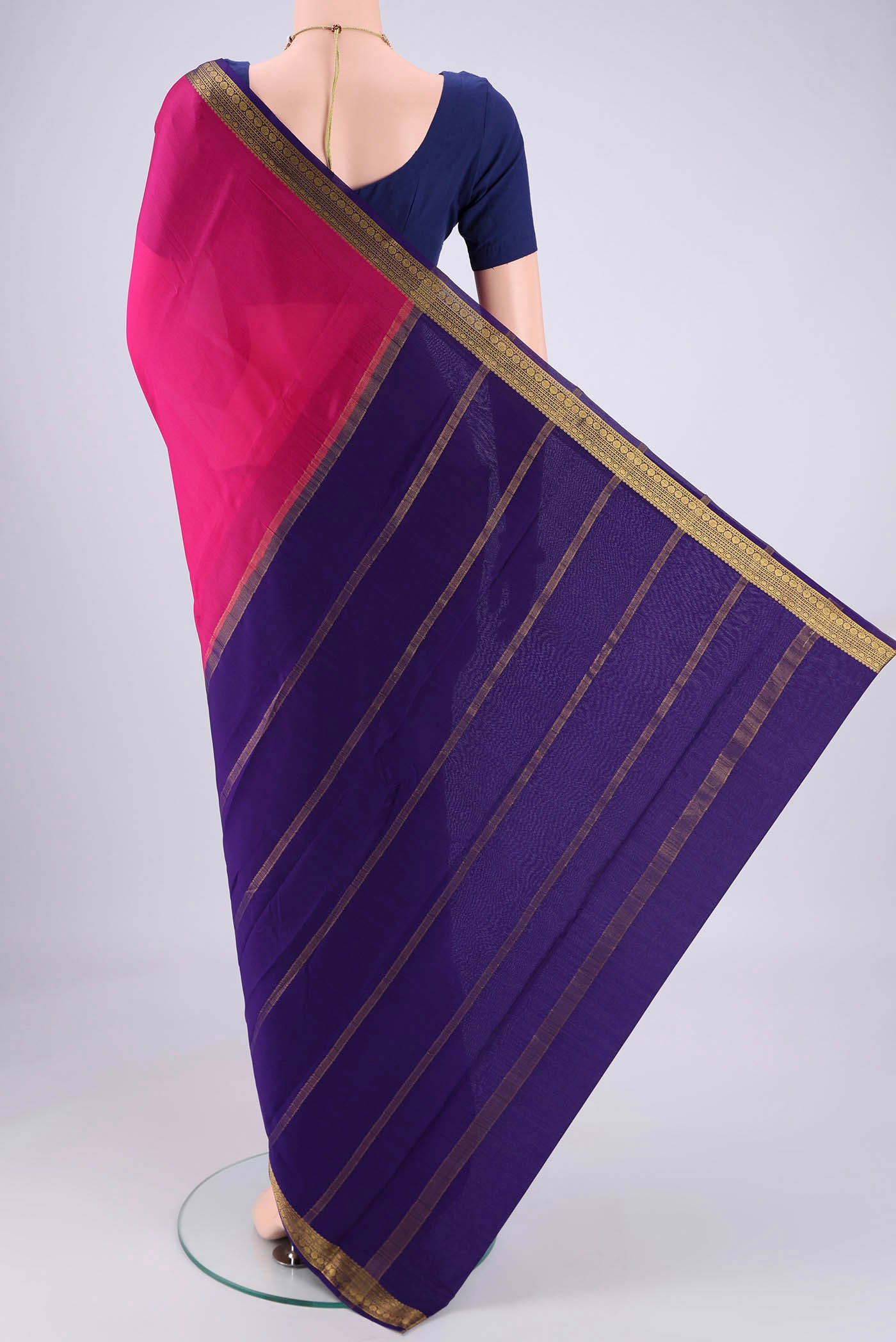 Flat view of Rani Pink Mysore Crepe Saree with Plain Body and Zari Border. 