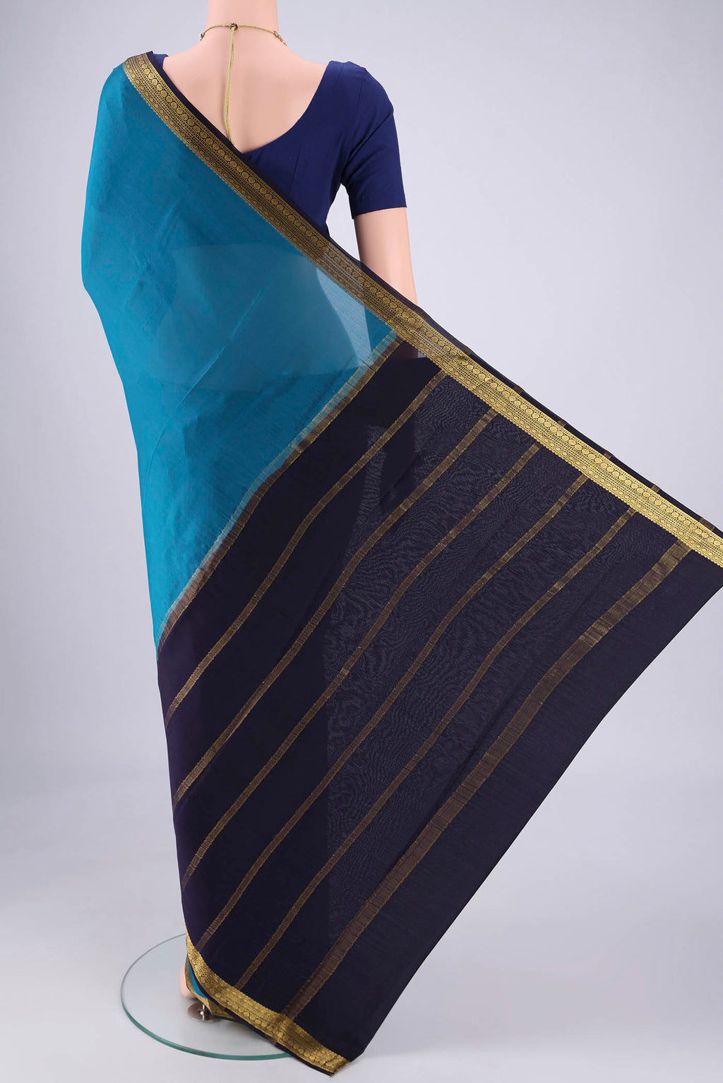 Flat view of Teal Mysore Crepe Saree with Plain Body and Zari Border. 