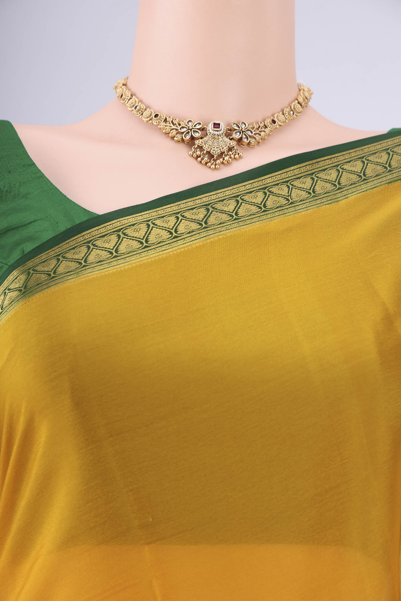 Border image of Mustard Mysore Crepe Saree with Plain Body and Zari Border. 