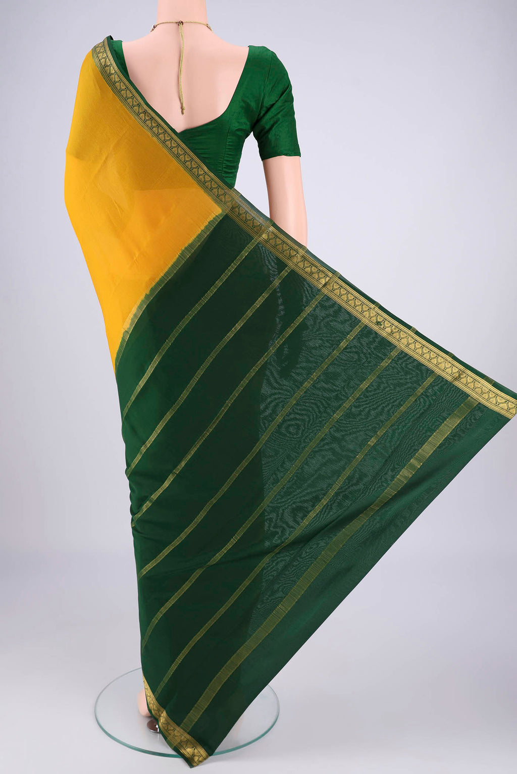 Flat view of Mustard Mysore Crepe Saree with Plain Body and Zari Border. 