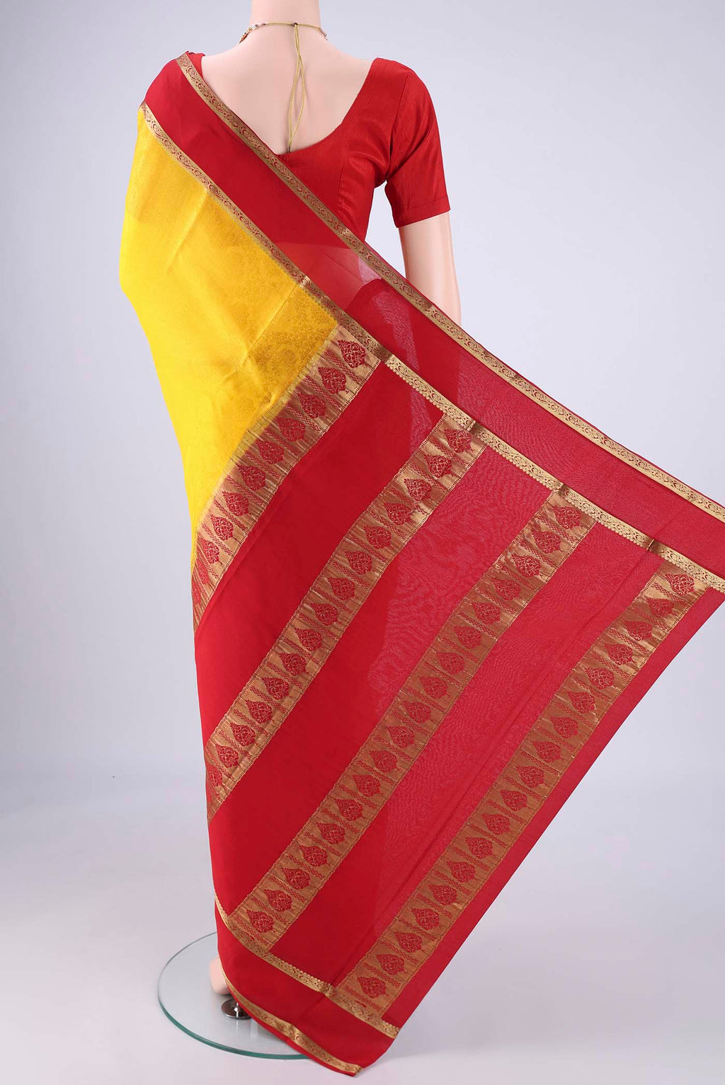 Flat view of Yellow Mysore Crepe Saree with Jacquard design on the body and Zari Border. 